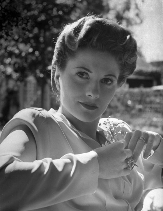 Joan Fontaine in her film make-up and pompadour.