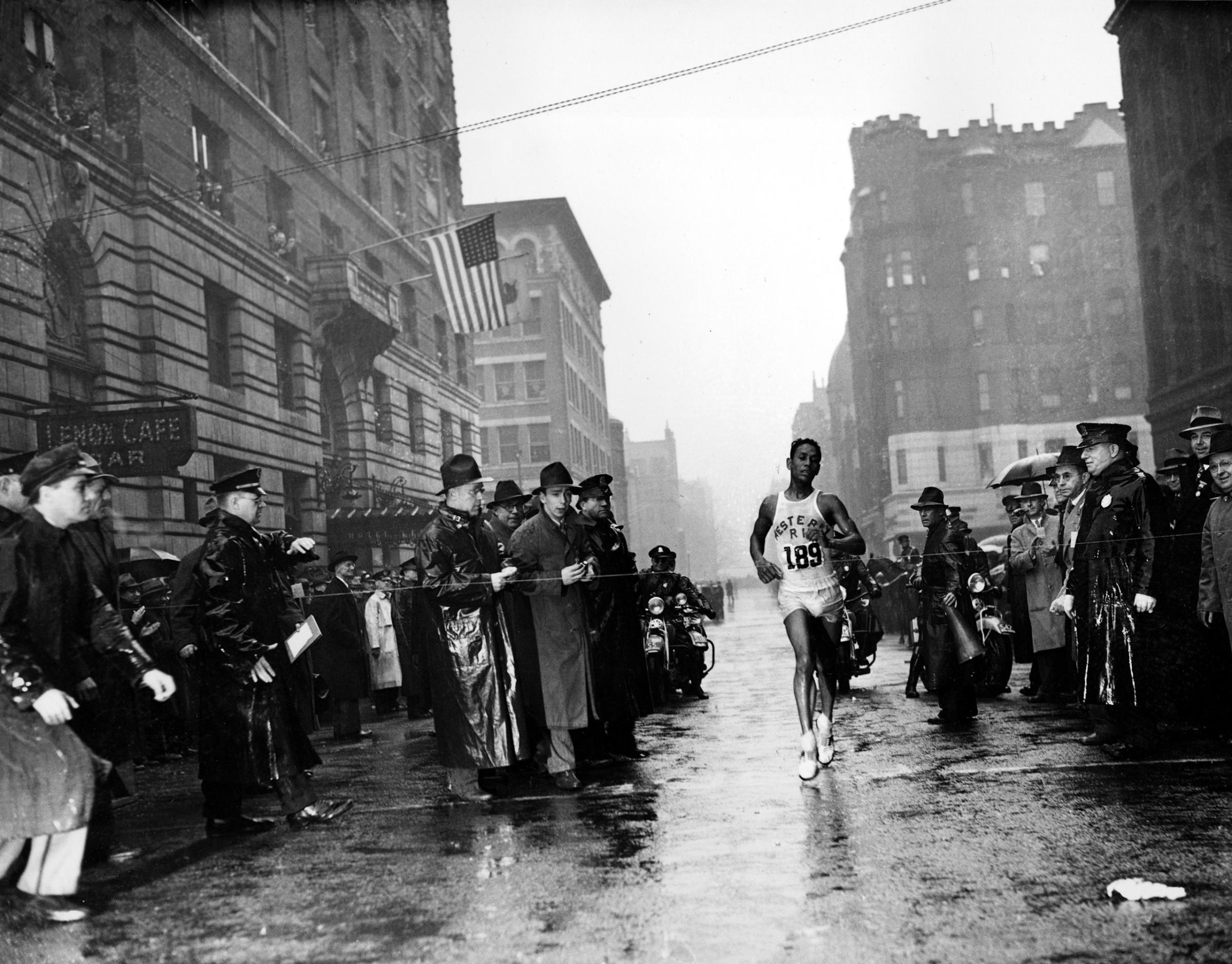 Ellison M. "Tarzan" Brown, from Alton, R.I., crosses the finish line in the 43rd Boston Marathon, 1939.