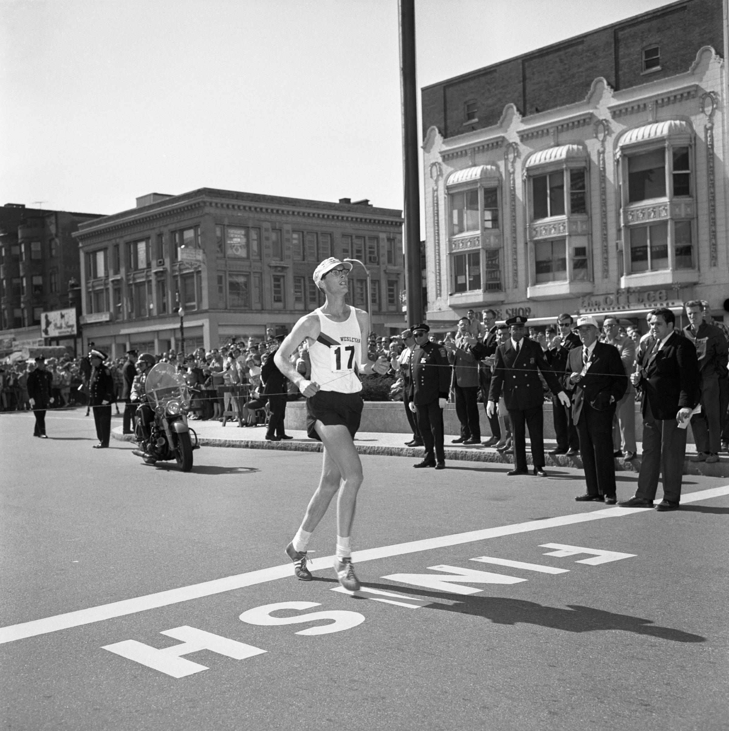 Ambrose Burfoot #17 of Wesleyan University crosses the finish line of 72nd running of the Boston Marathon, 1968.