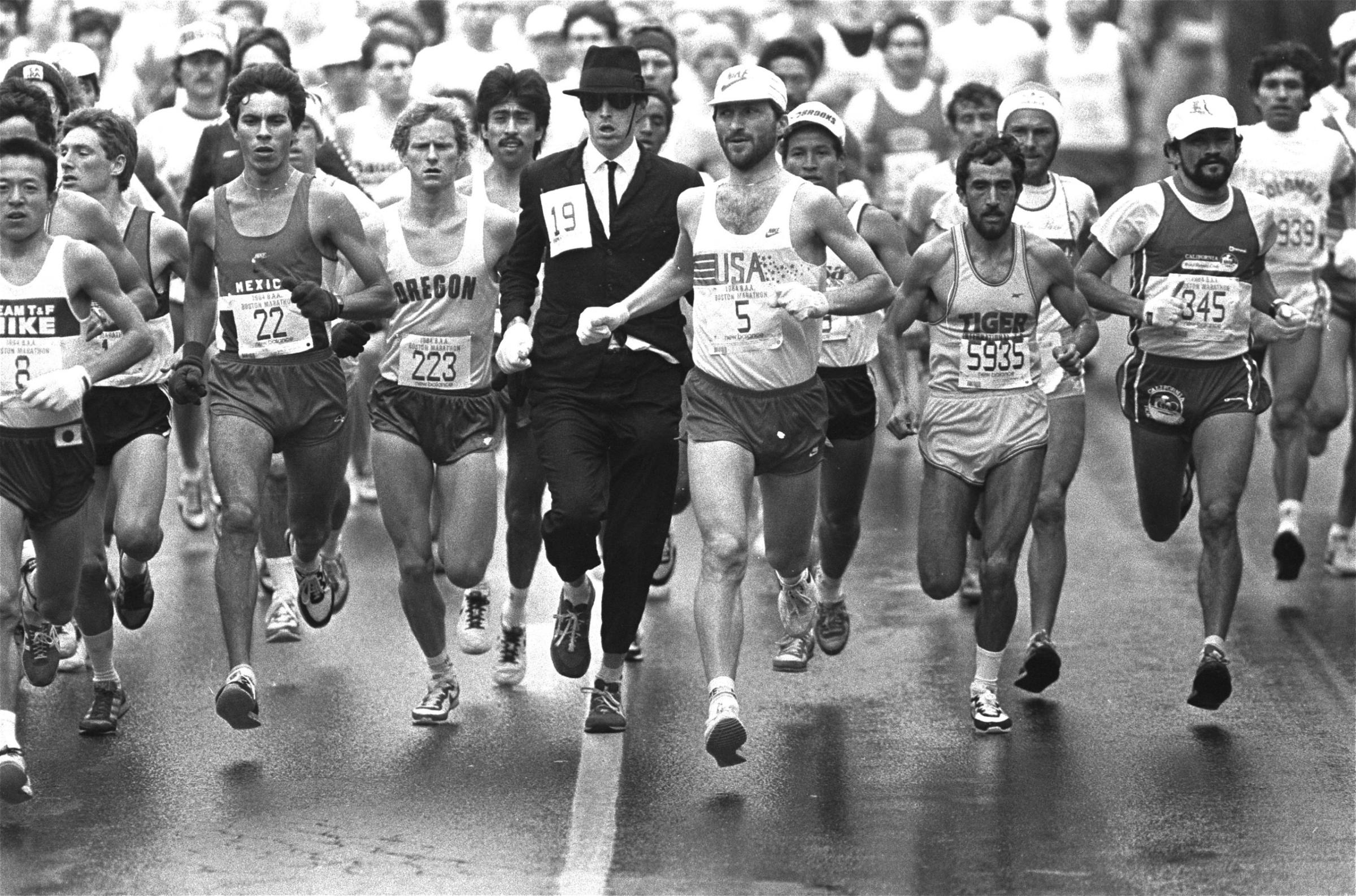 An unidentified man attired in business suit and black hat, jumped into the Boston Marathon pack Monday, April 17, 1984.