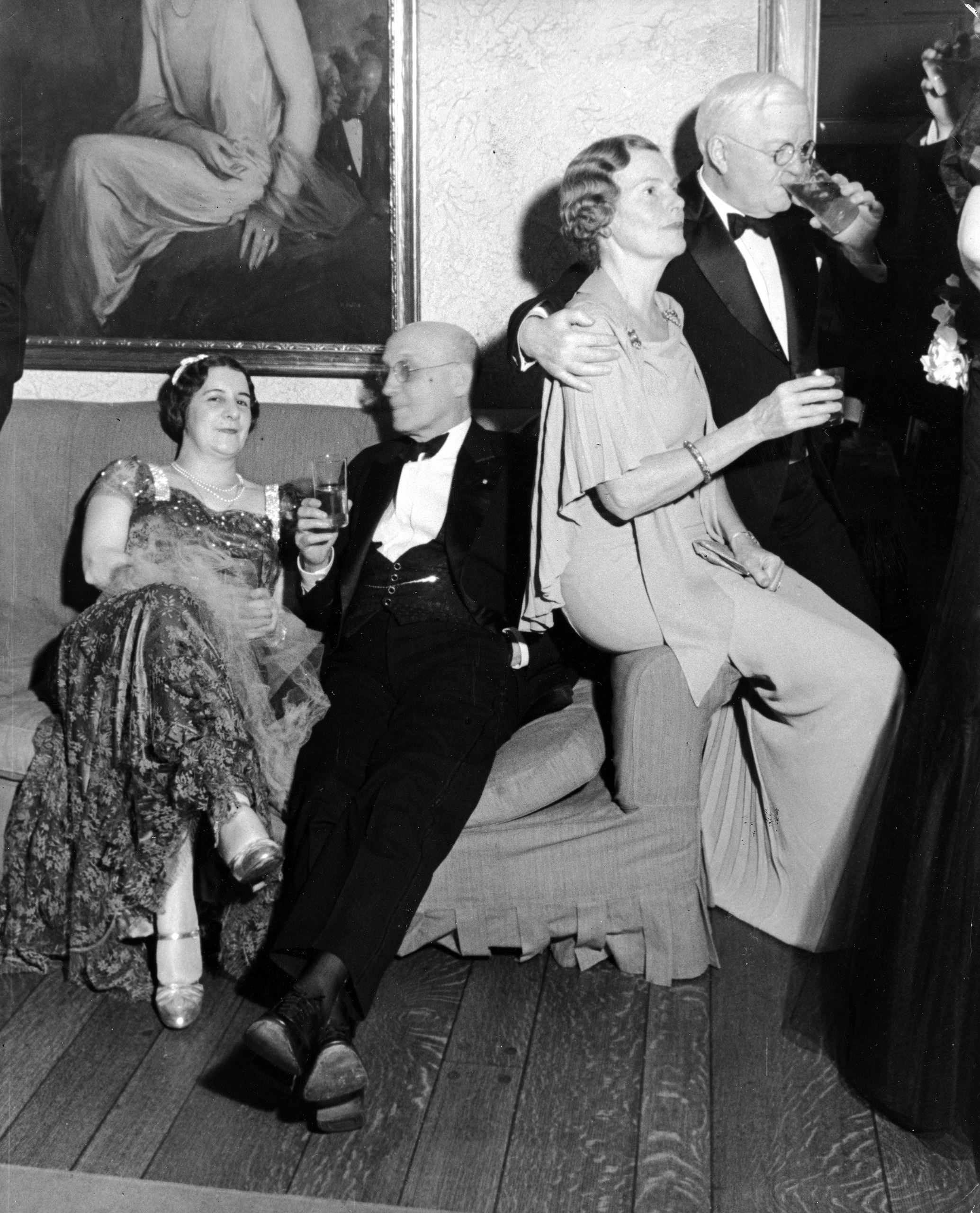 Changing into evening dress, many Van Winkle guests proceeded to Mrs. Henry J. Powell's buffet supper. Above, left to right, Mrs. Rowan Morrison, Gustave Breux, Mrs. William C. Hall and Judge Arthur Peter. The tall glasses contain not mint juleps but Bourbon and soda.