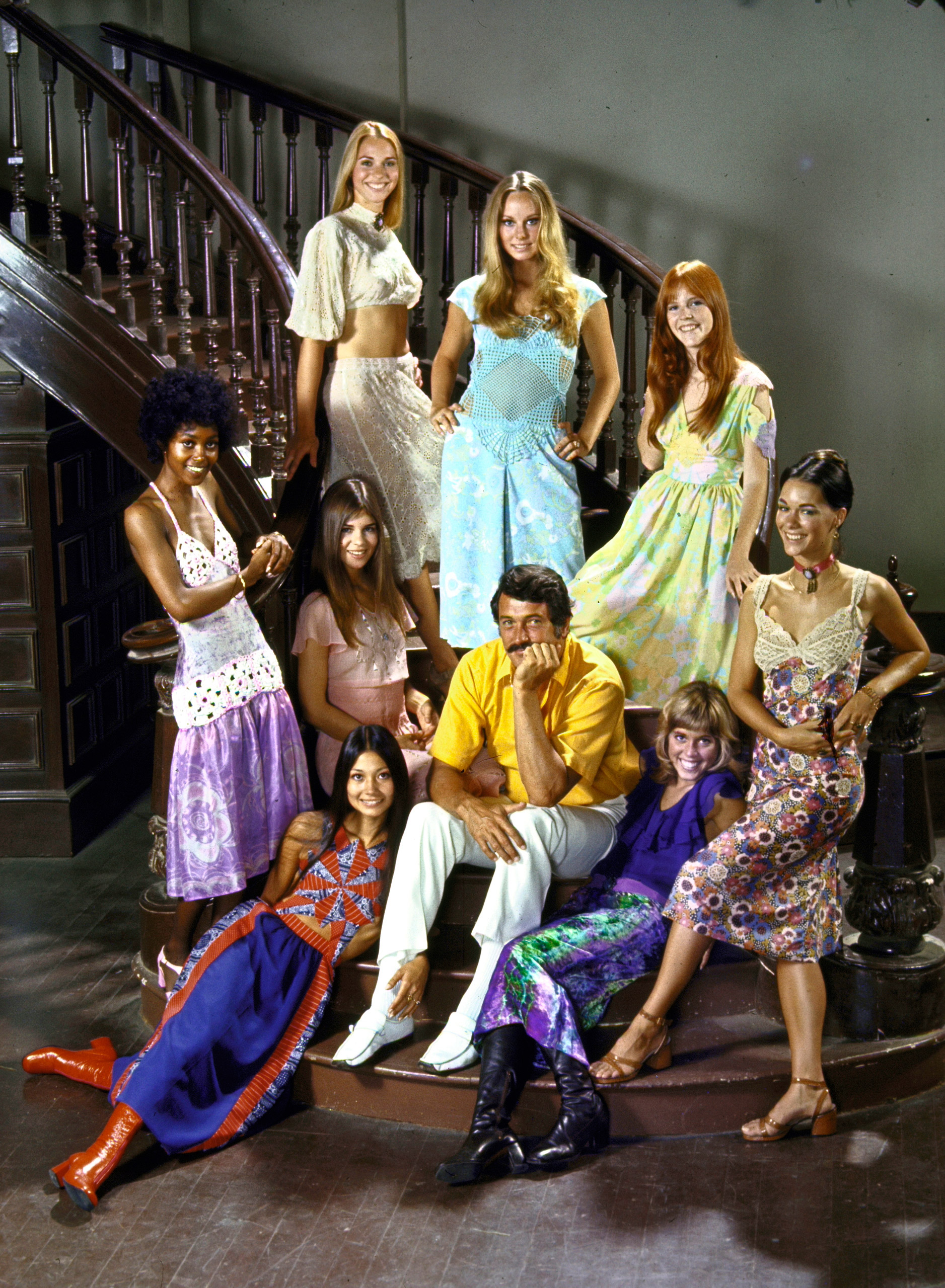 Rock Hudson doesn't agree. He sits on the MGM lot surrounded by the eight midiskirted starlets who will appear with him in the upcoming movie Pretty Maids All in a Row. Of midi's, Rock says, "Yechh!"