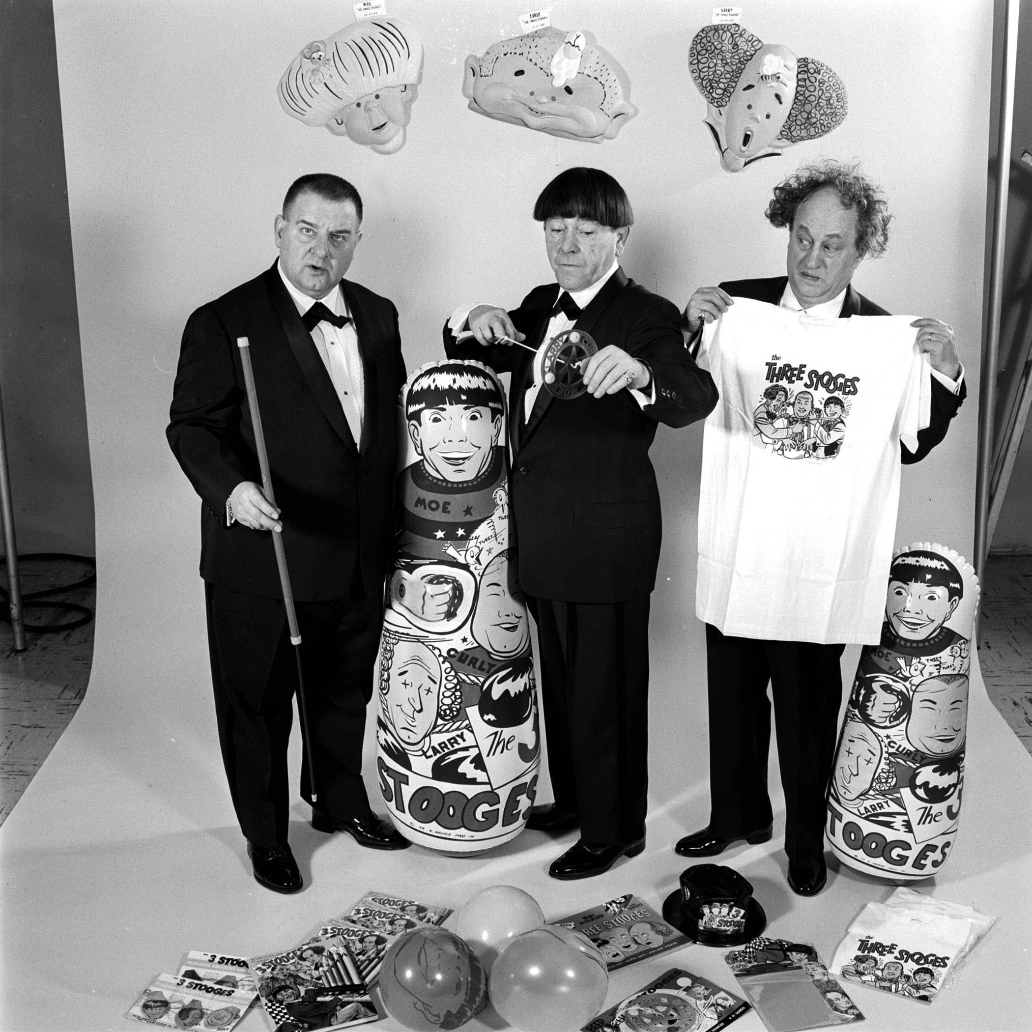 Three Stooges posing with some of their products in May 1959.