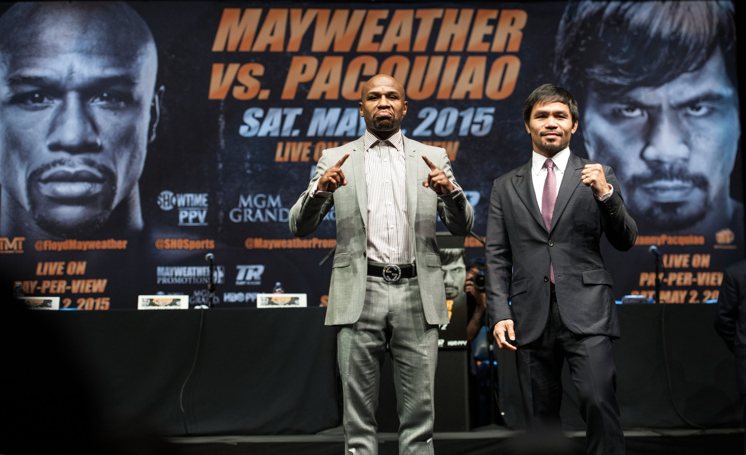 Floyd Mayweather Jr., and Manny Pacquiao strike their pose after a news conference Wednesday, March 11, 2015, in Los Angeles. Mayweather and Pacquiao are scheduled to fight on May 2 in Las Vegas.