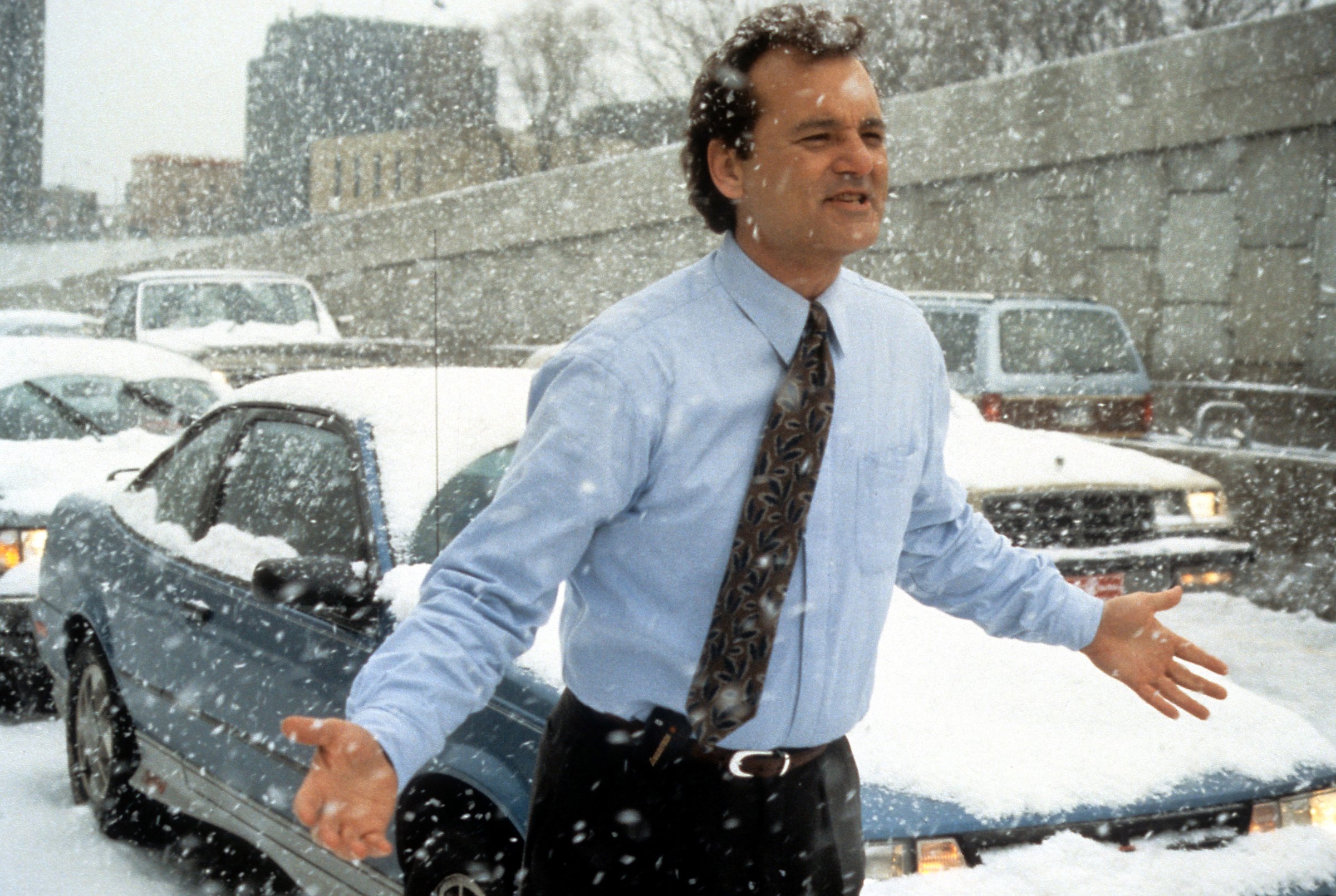 Bill Murray runs through the snow in a scene from the film Groundhog Day in 1993.