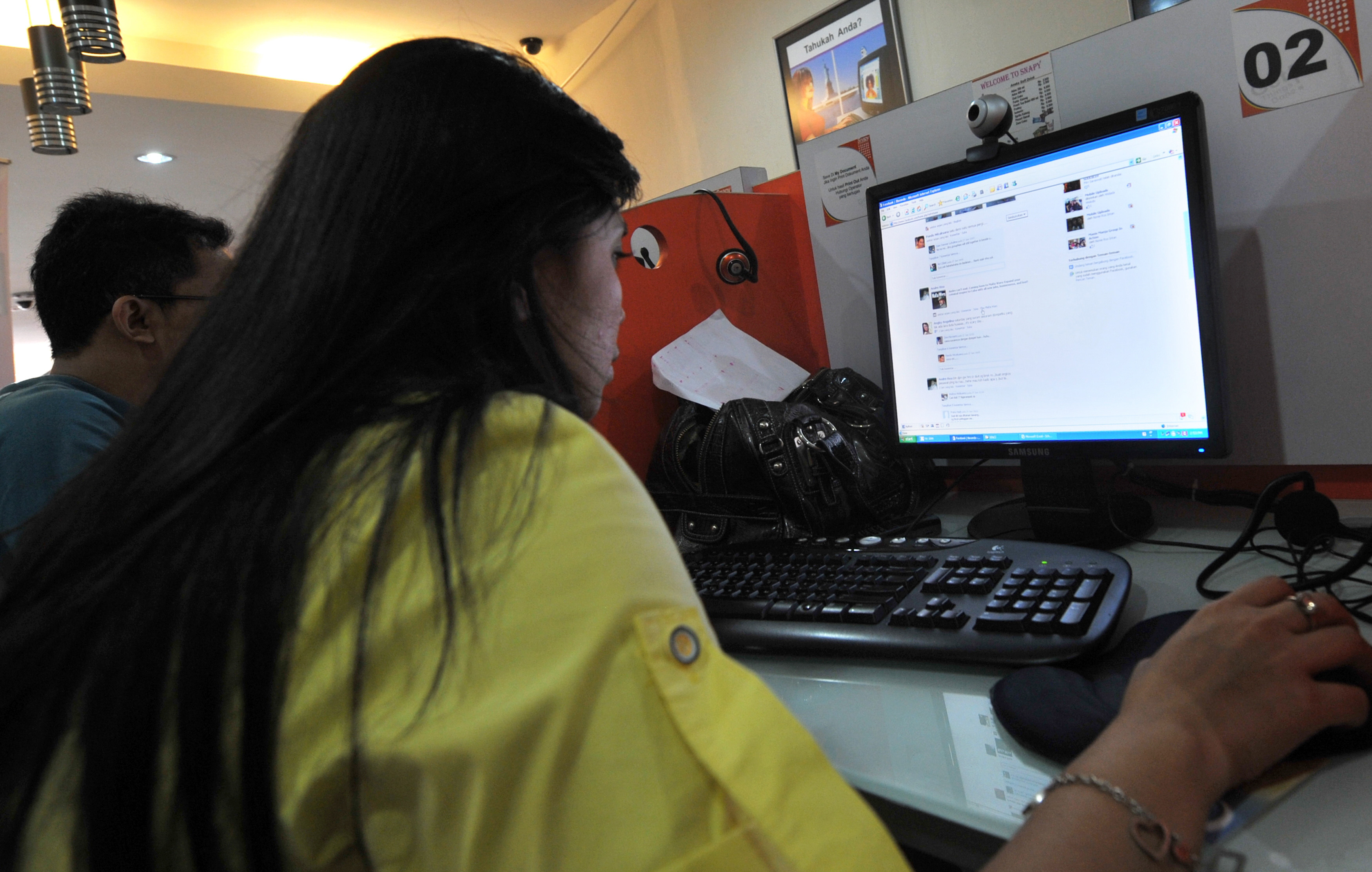 A picture taken on June 27, 2009, shows an lndonesian Facebook patron looking at her page at an internet shop in Jakarta (ROMEO GACAD—AFP/Getty Images)