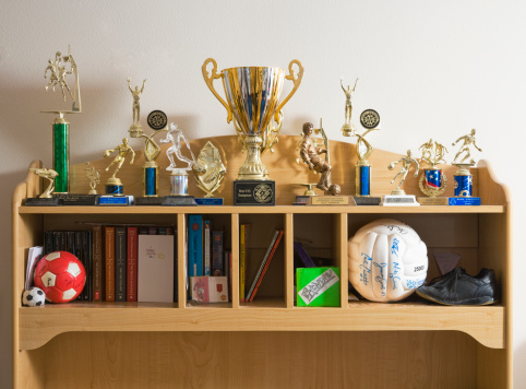 sports-trophies-books-shelves