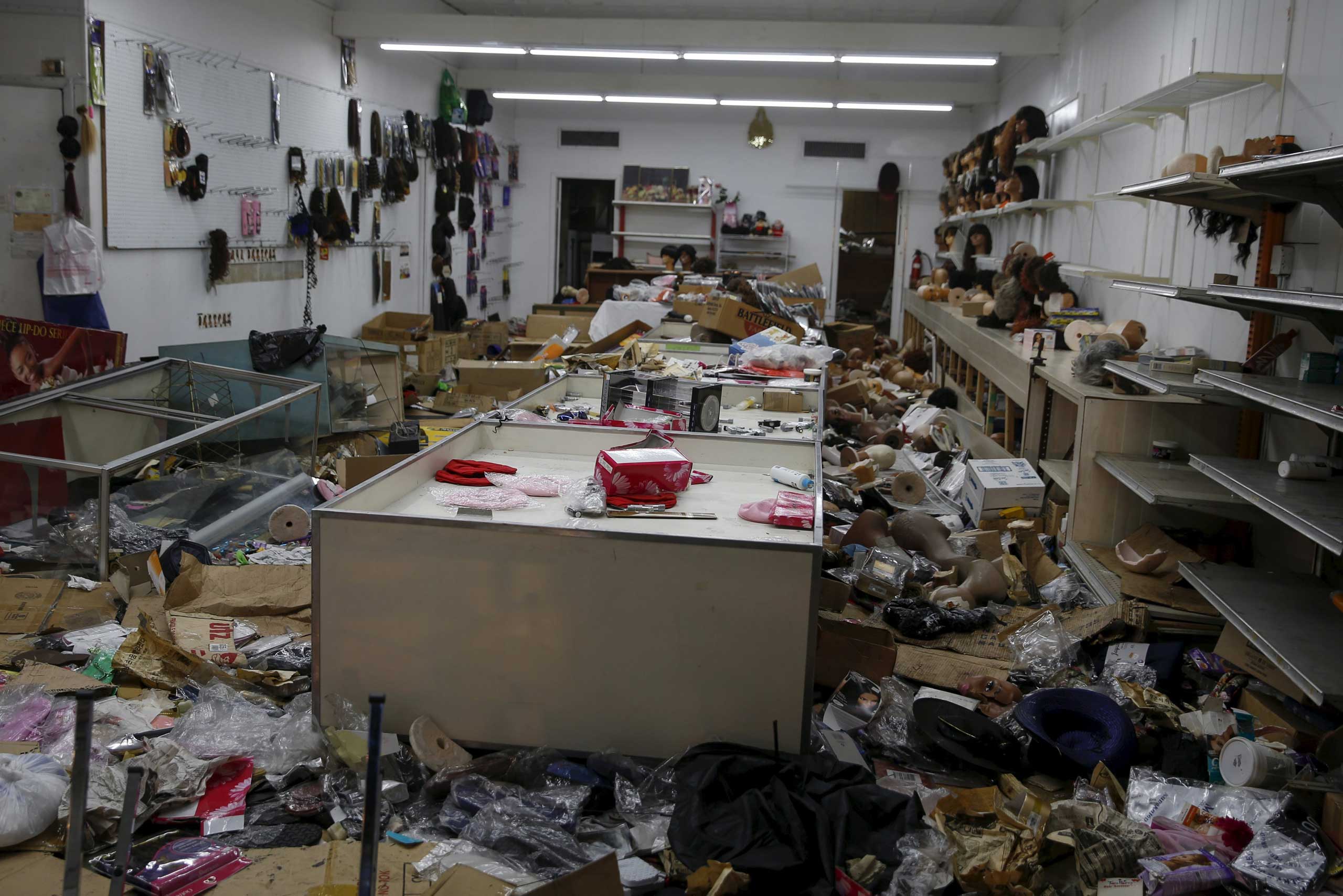 A looted wig shop is seen damaged after a night of riots in Baltimore on April 28, 2015.
