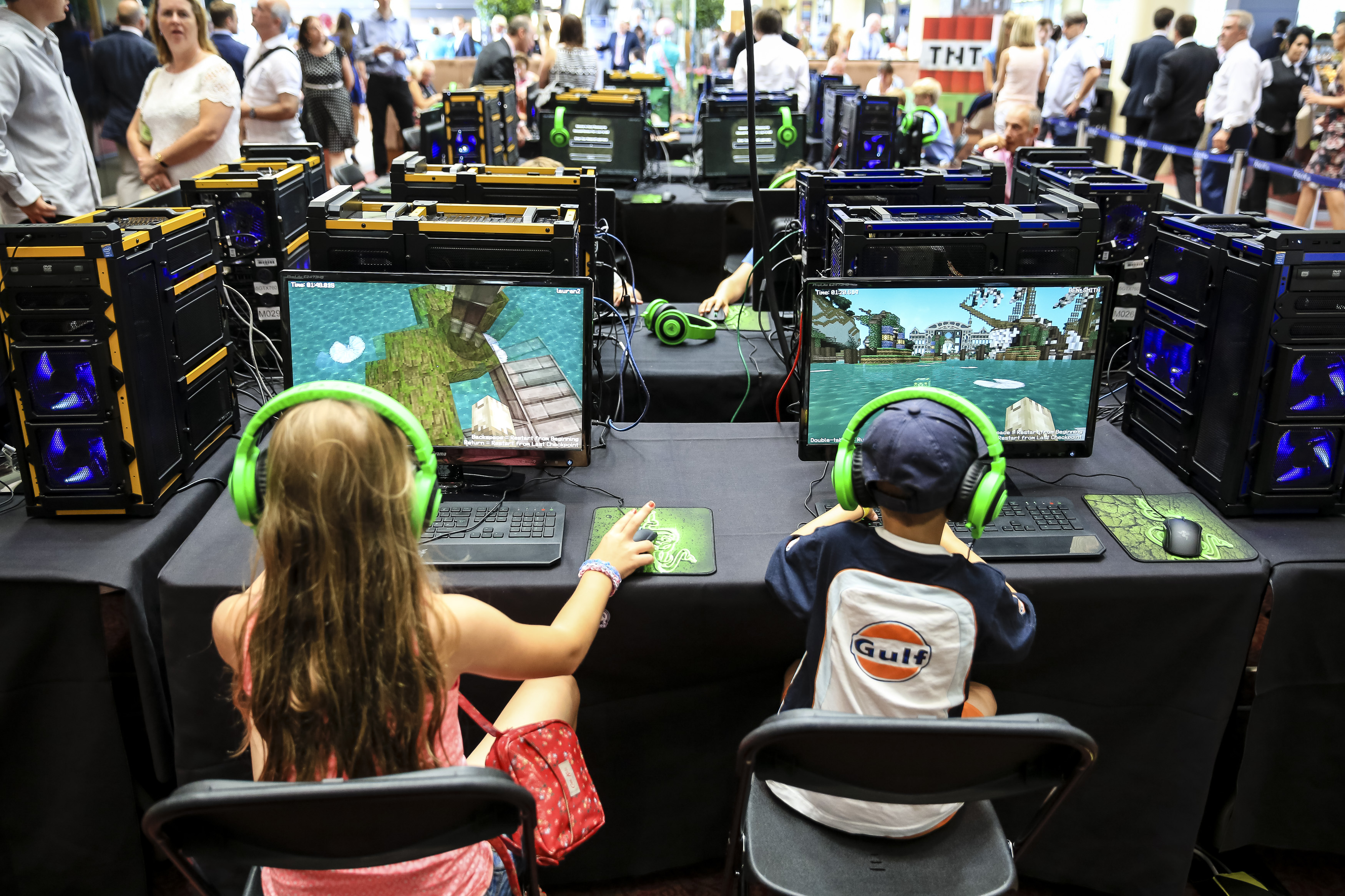 Young racegoers play in a Minecraft tournament during Ascot Dubai Duty Free Shergar Cup and Concert at Ascot Racecourse on August 9, 2014 in Ascot, England. (Miles Willis—Getty Images)
