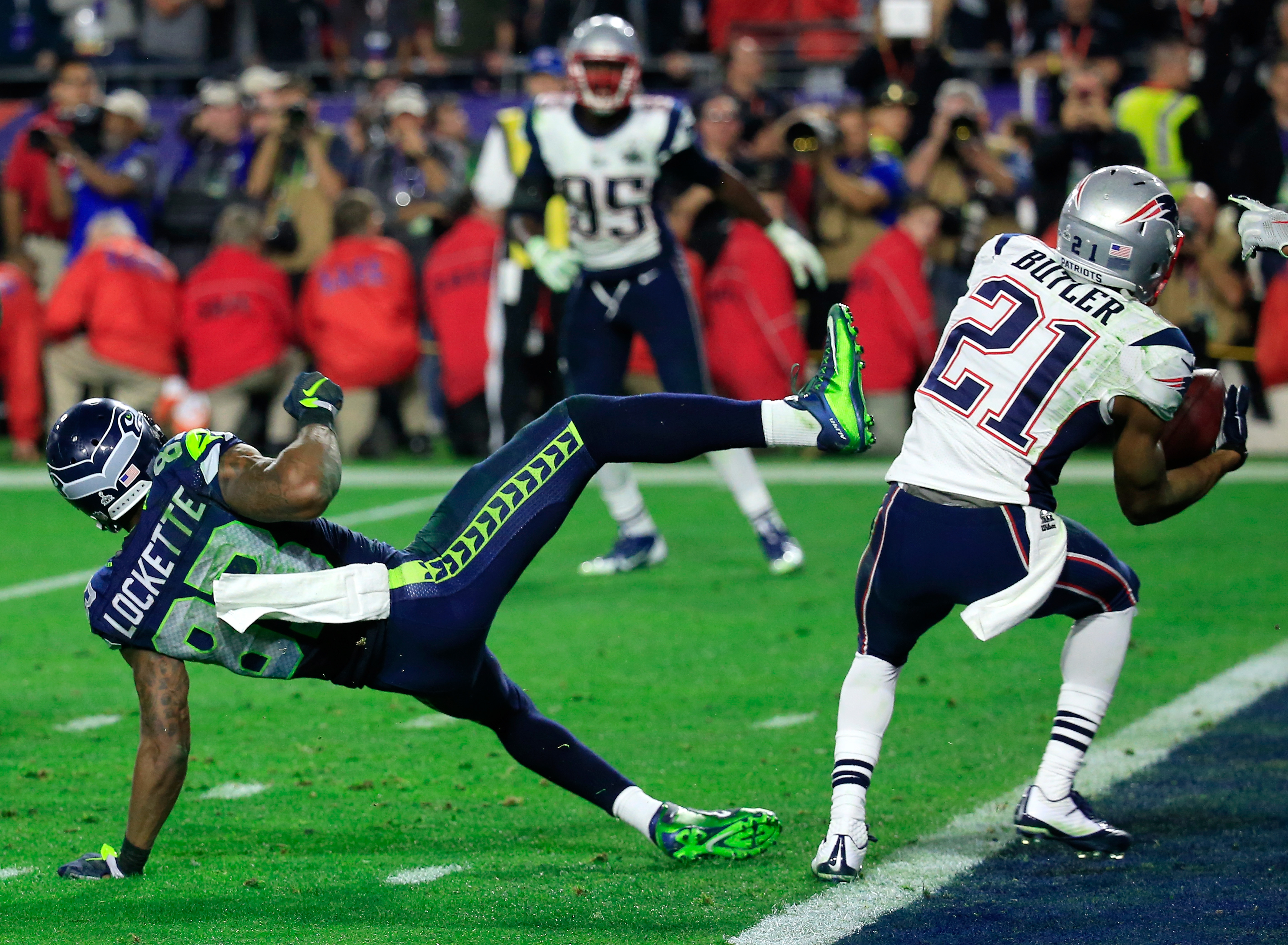 Malcolm Butler #21 of the New England Patriots intercepts a pass by Russell Wilson #3 of the Seattle Seahawks intended for  Ricardo Lockette #83 late in the fourth quarter during Super Bowl XLIX at University of Phoenix Stadium on February 1, 2015 in Glendale, Arizona. (Rob Carr—Getty Images)