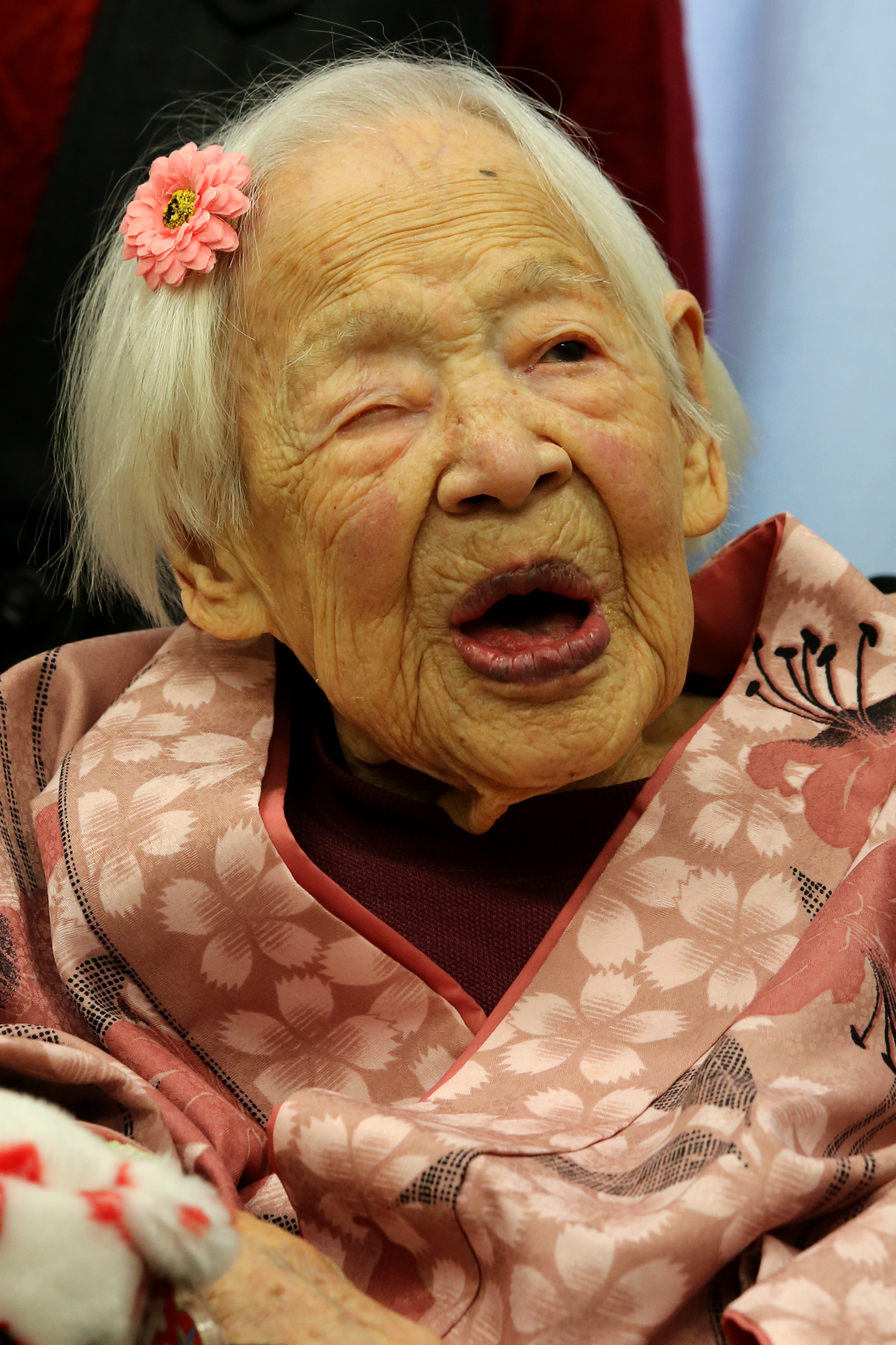Misao Okawa, the world's oldest Japanese woman, poses for a photo on her 117th birthday celebration at Kurenai Nursing Home on March 4, 2015, in Osaka, Japan (Buddhika Weerasinghe—Getty Images)