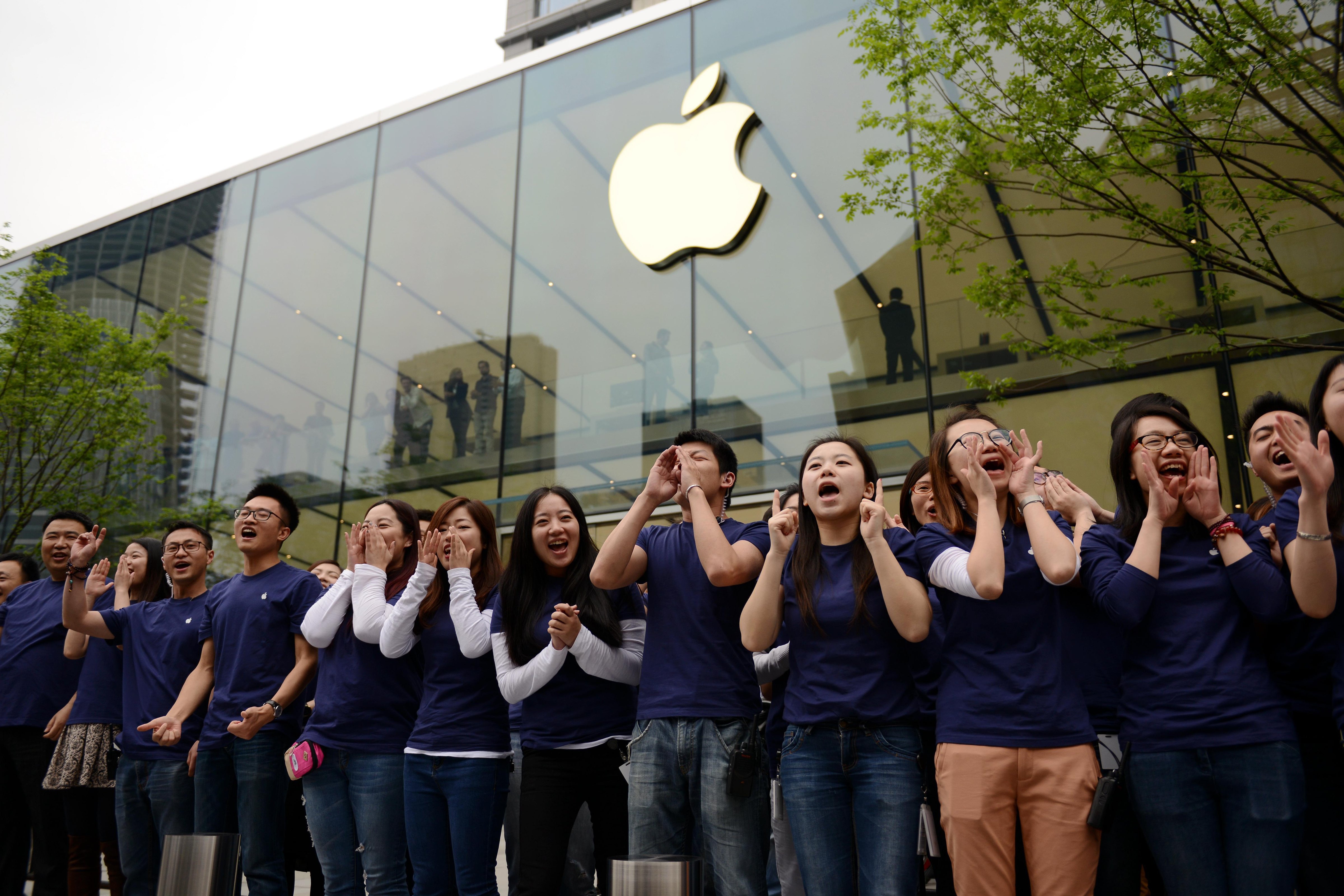 Apple Store assistants celebrate the second Apple Store open at the Mixc Mall on its first day open on April 24, 2015 in Hangzhou, Zhejiang province of China. (ChinaFotoPress—ChinaFotoPress via Getty Images)