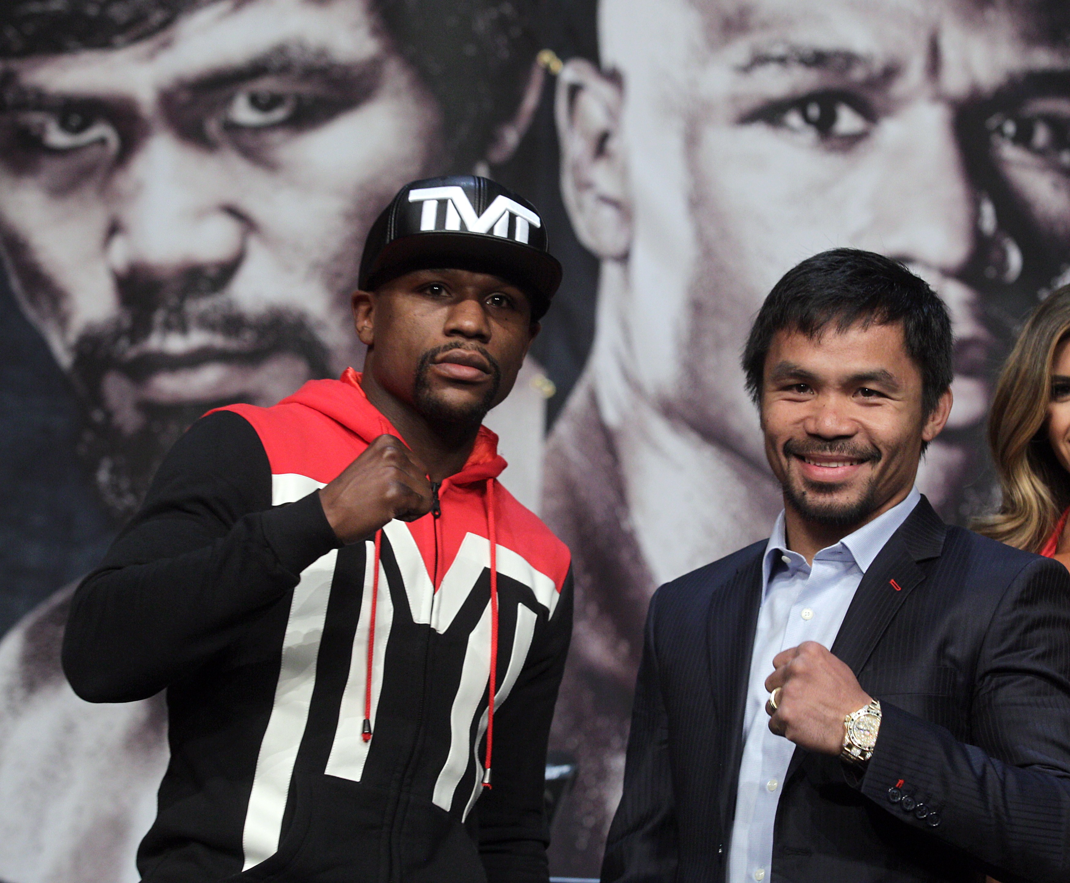 WBC/WBA welterweight champion Floyd Mayweather Jr. (L) and WBO welterweight champion Manny Pacquiao pose during a news conference at the KA Theatre at MGM Grand Hotel &amp; Casino on April 29, 2015 in Las Vegas, Nevada. The two will face each other in a unification bout on May 2, 2015 in Las Vegas. (JOHN GURZINSKI—AFP/Getty Images)