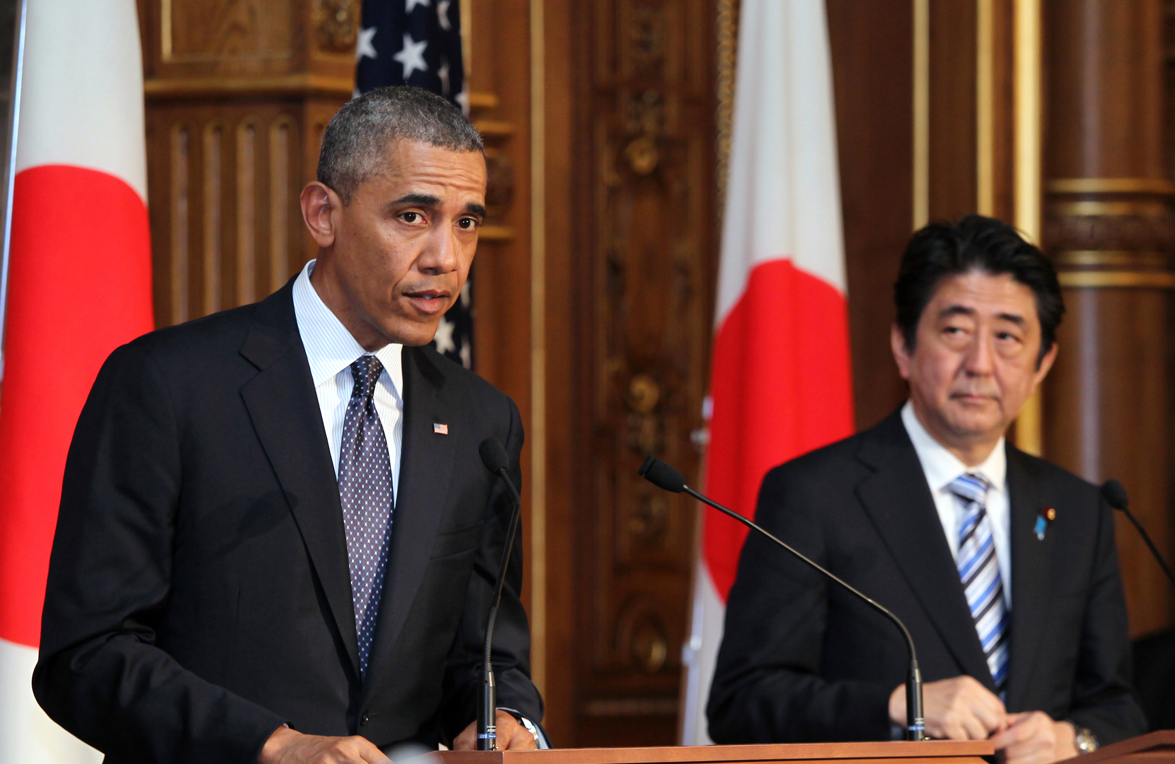 U.S. President Barack Obama, left, speaks as Shinzo Abe, Japan's prime minister, looks on during a joint news conference at the State Guest House in Tokyo, Japan, on Thursday, April 24, 2014. (Junko Kimura—Matsumoto/Pool/ Bloomberg)
