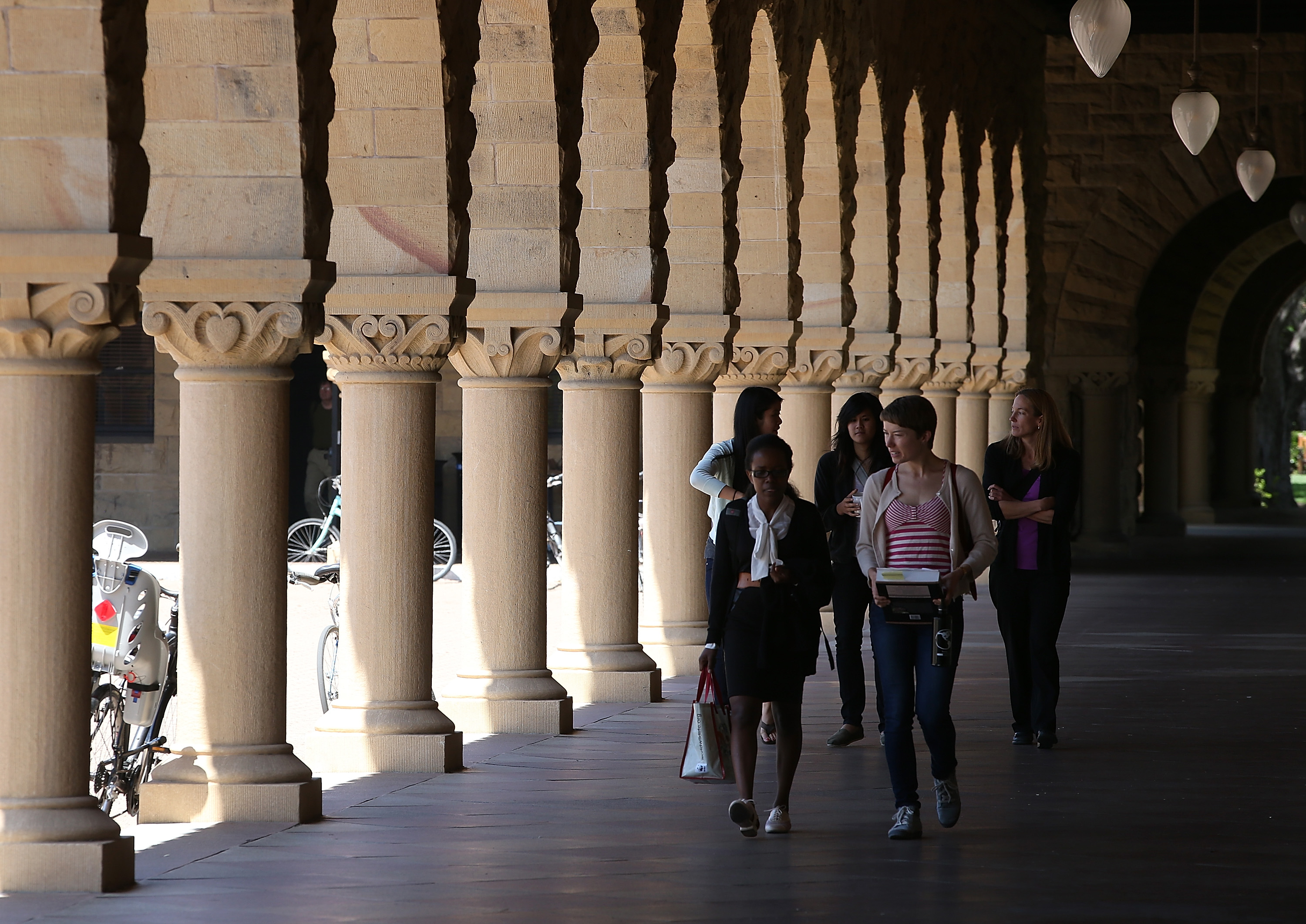 People walk through the Stanford University campus on May 22, 2014 in Stanford, California. (Justin Sullivan—Getty Images)