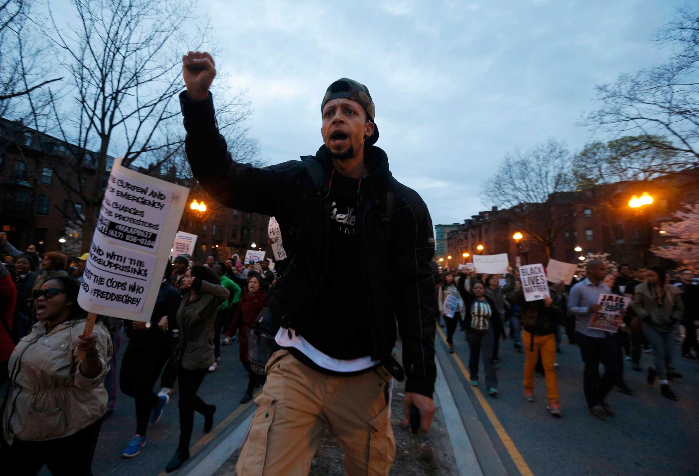 People march in protest against police violence in Boston on April 29, 2015.