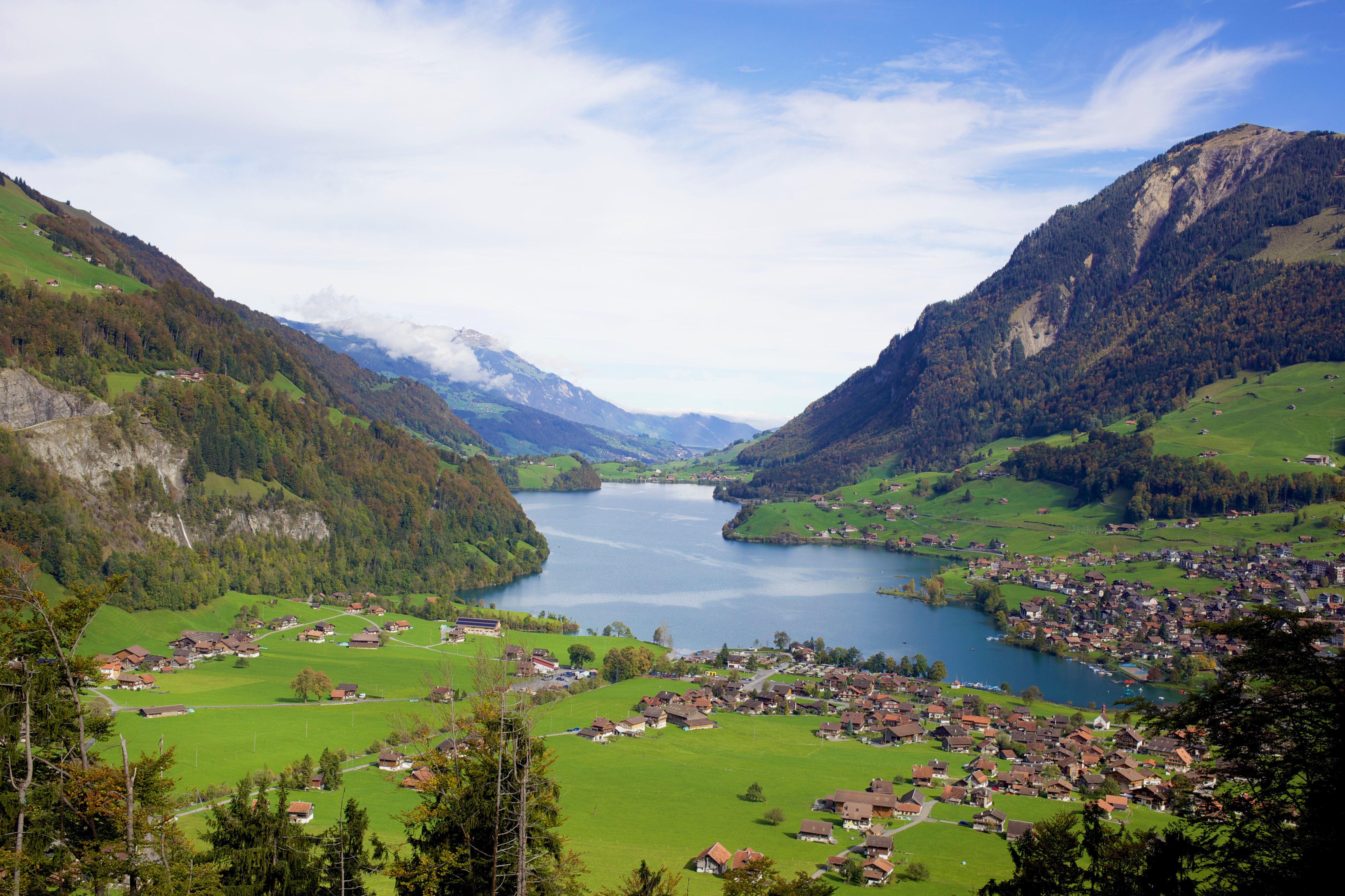 View of mountains and lakeside village, Switzerland (Dale Reubin—Getty Images/Cultura RF)