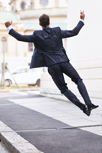 suited-man-jumping