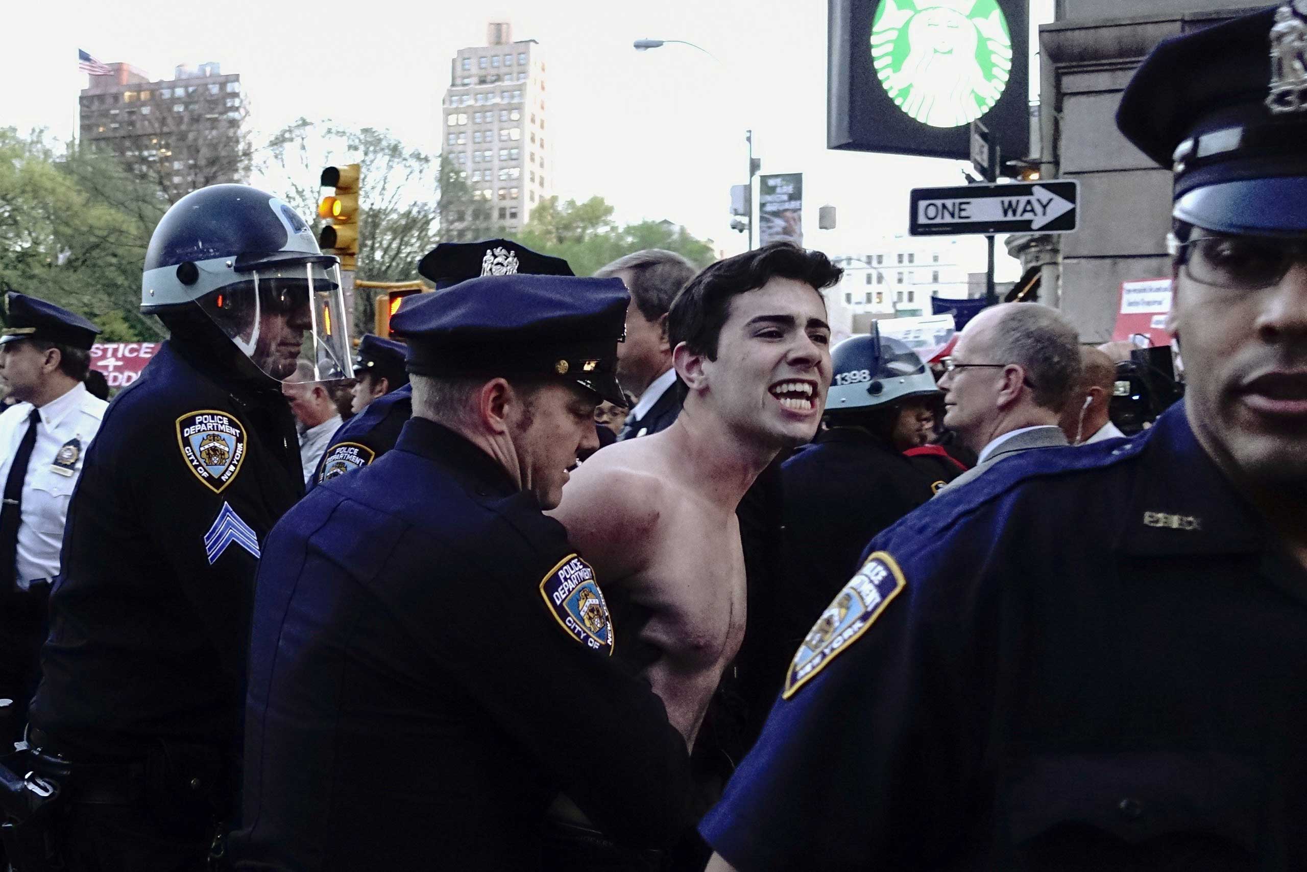 A demonstrator is arrested by NYPD officers during a protest at Union Square in New York City on April 29, 2015.