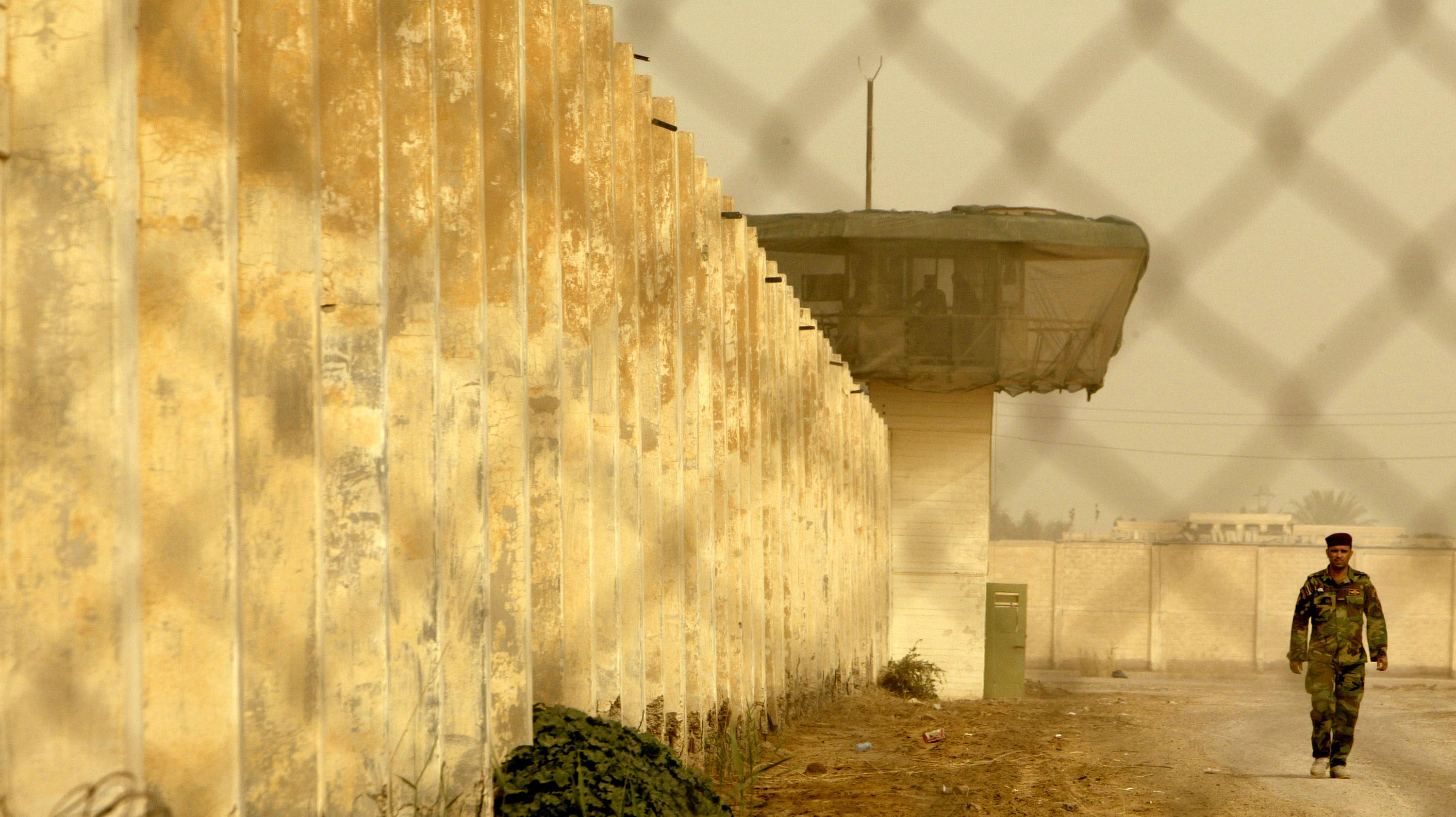 An Iraqi security officer patrols the grounds at the newly opened Baghdad Central Prison in Abu Ghraib on February 21, 2009 in Baghdad.
