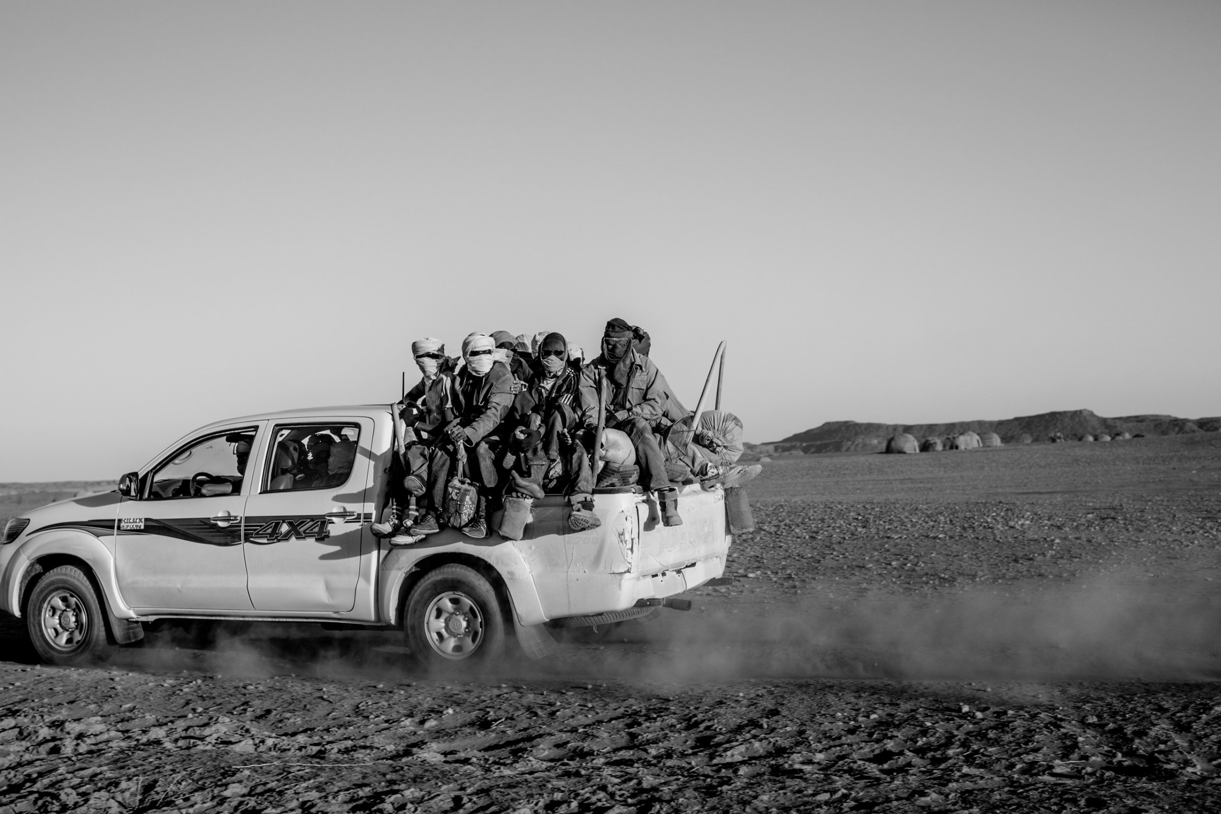 Migrants are stuffed into the back of a pickup truck as they begin the first day of their five day journey across the Sahara to Libya, in Niger on April 20, 2015.