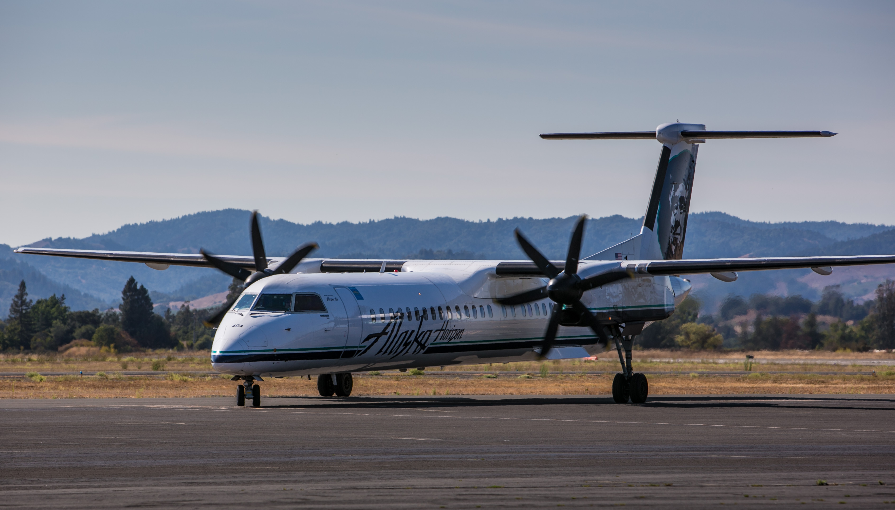 An Alaska Airlines Bombardier Q-400 regional turbo prop plane pulls into the gate at Charles M. Schulz Airport on August 27, 2014, near Healdsburg, California. (George Rose—Getty Images)