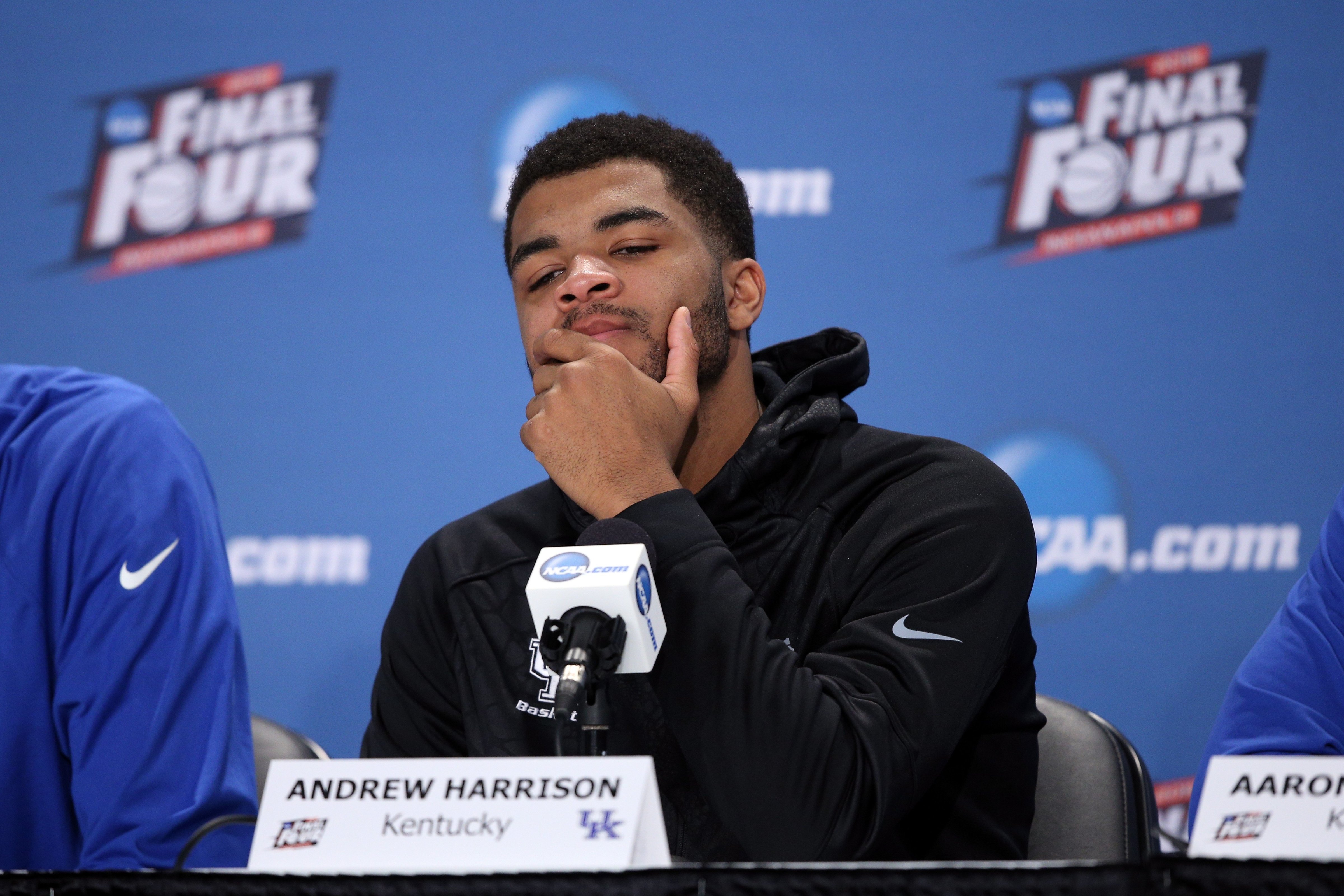 Andrew Harrison of the Kentucky Wildcats reacts in the post game press conference after being defeated by the Wisconsin Badgers during the NCAA Men's Final Four Semifinal at Lucas Oil Stadium on April 4, 2015 in Indianapolis.