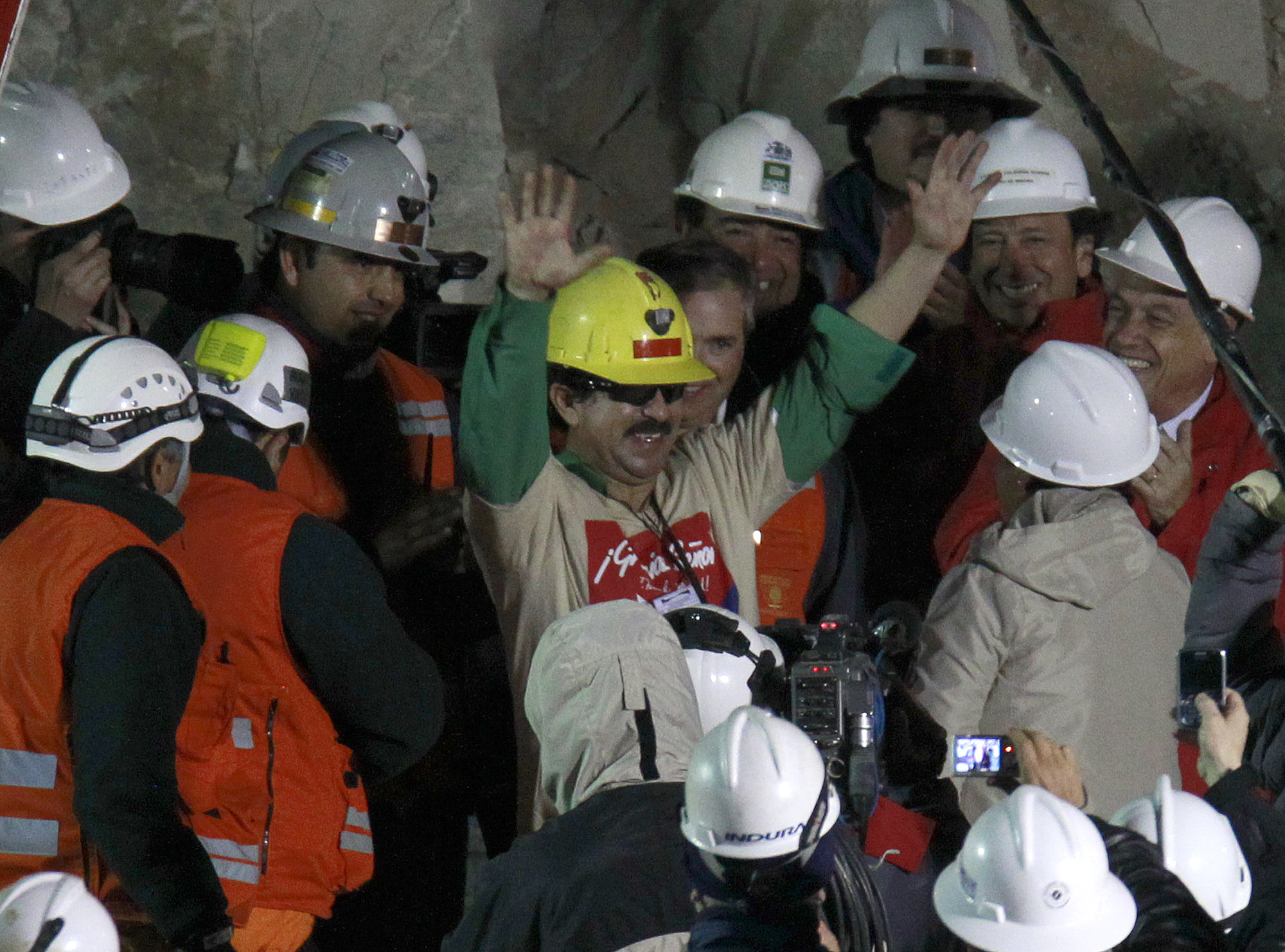Miner Juan Andres Illanes Palma salutes after being rescued from the collapsed San Jose gold and copper mine near Copiapo, Chile on Oct. 13, 2010. (Roberto Candia—AP)
