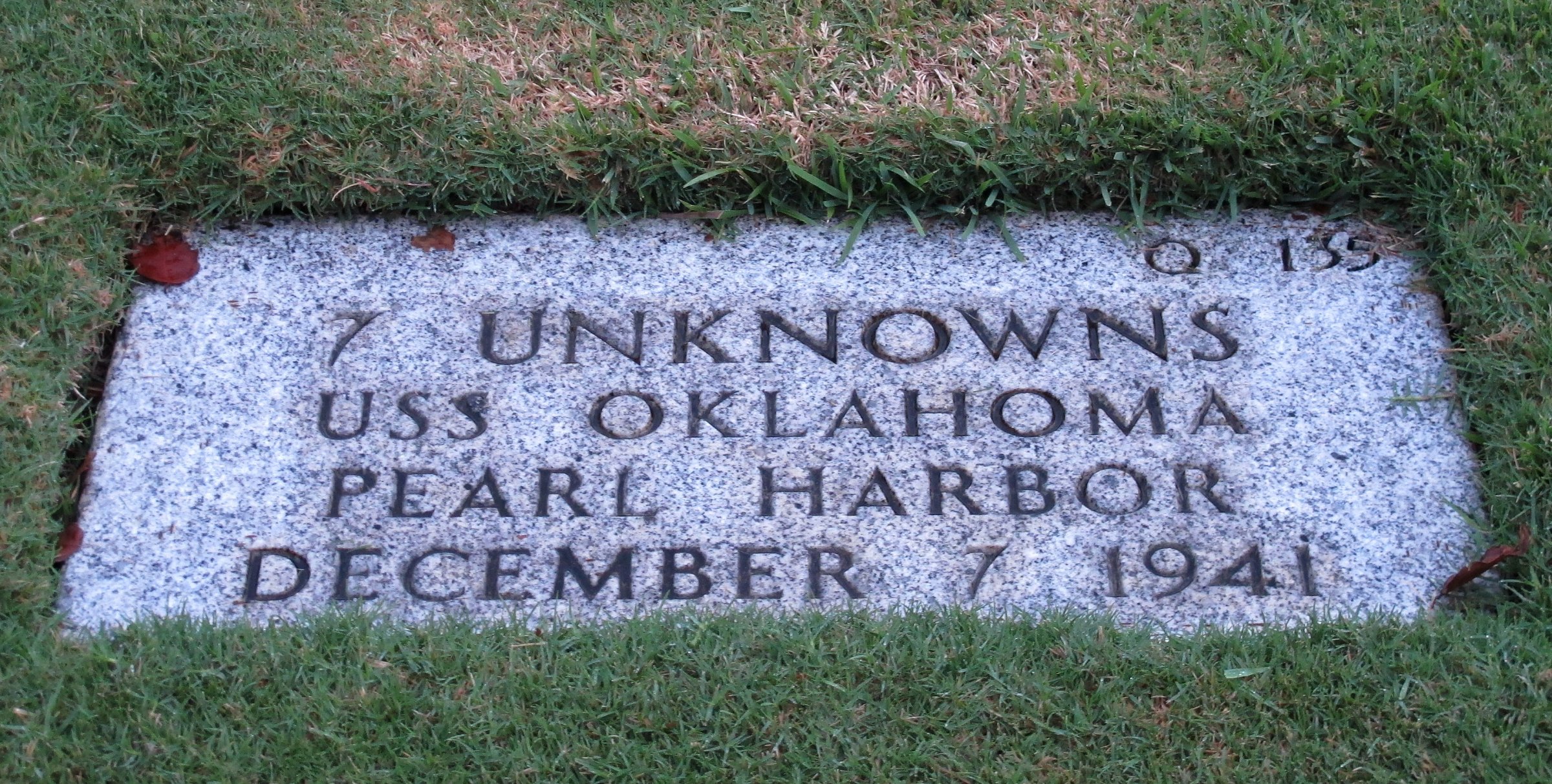 This Dec. 5, 2012 photo at the National Memorial Cemetery of the Pacific in Honolulu shows a gravestone of 7 unknowns from the USS Oklahoma