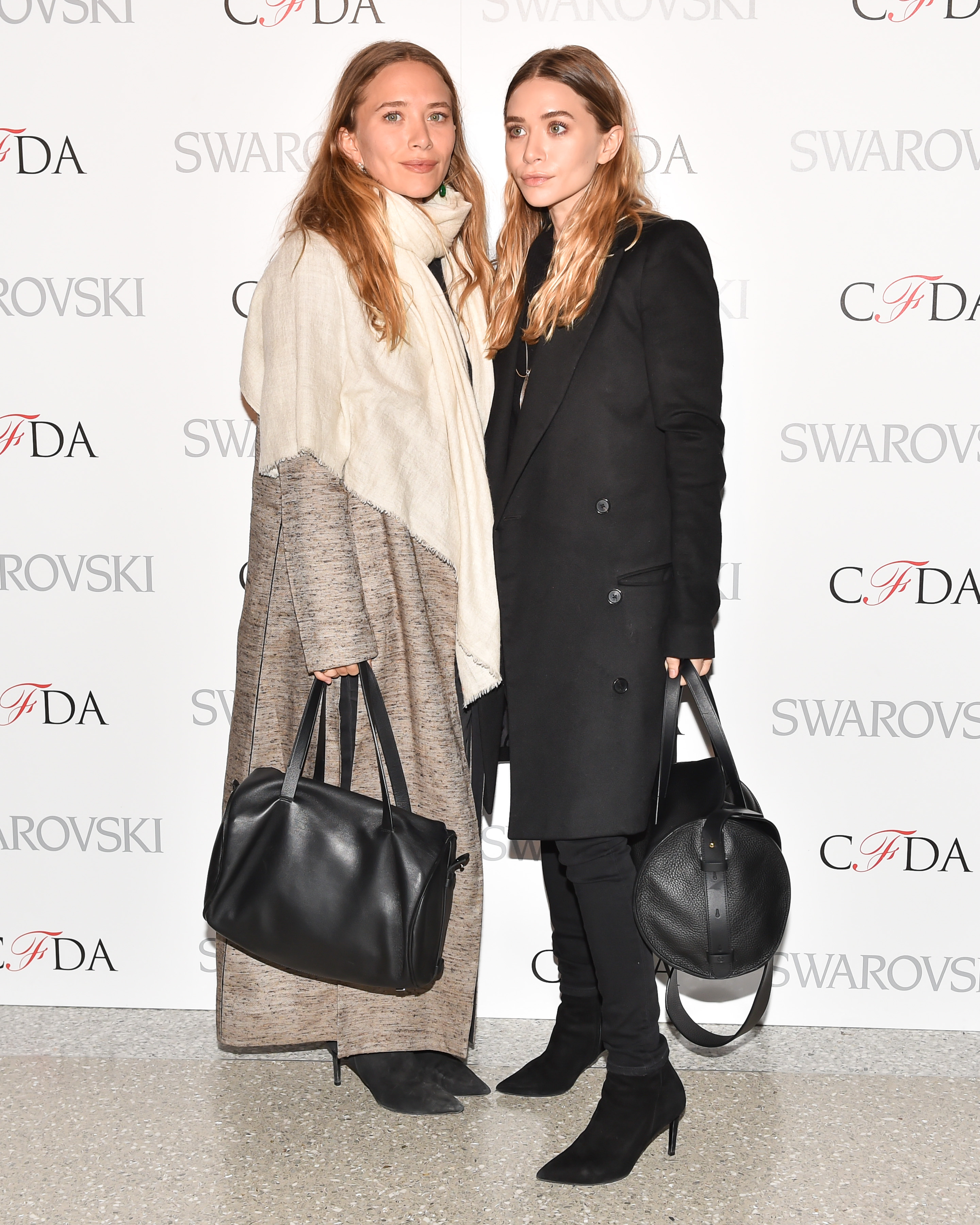 Mary-Kate Olsen (L) and Ashley Olsen attend 2015 CFDA Fashion Awards Announcement Party in New York City on March 16, 2015.