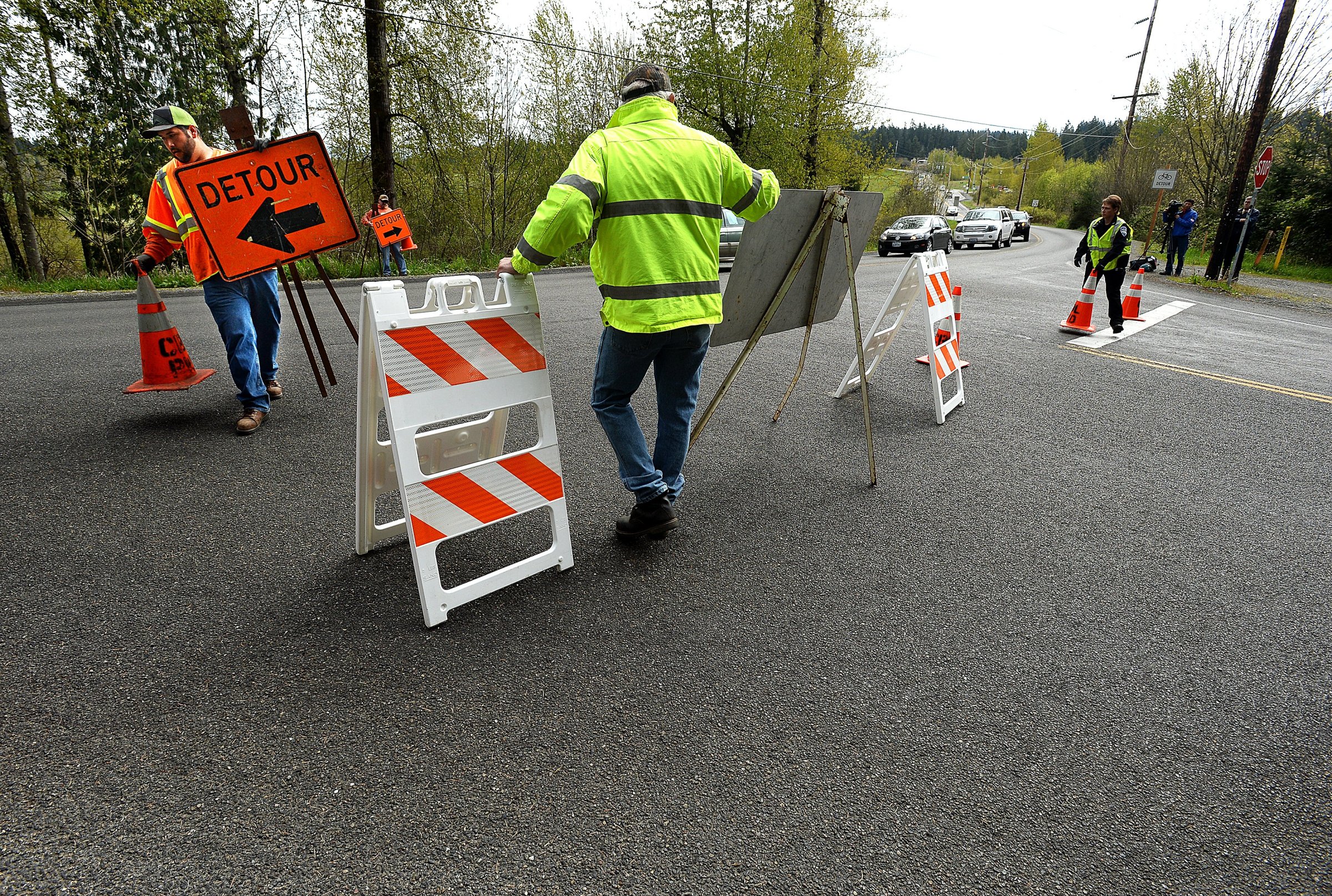 Workers with the Bonney Lake Public Works Department set up signs on April 13, 2015 in Bonney Lake, Wash.