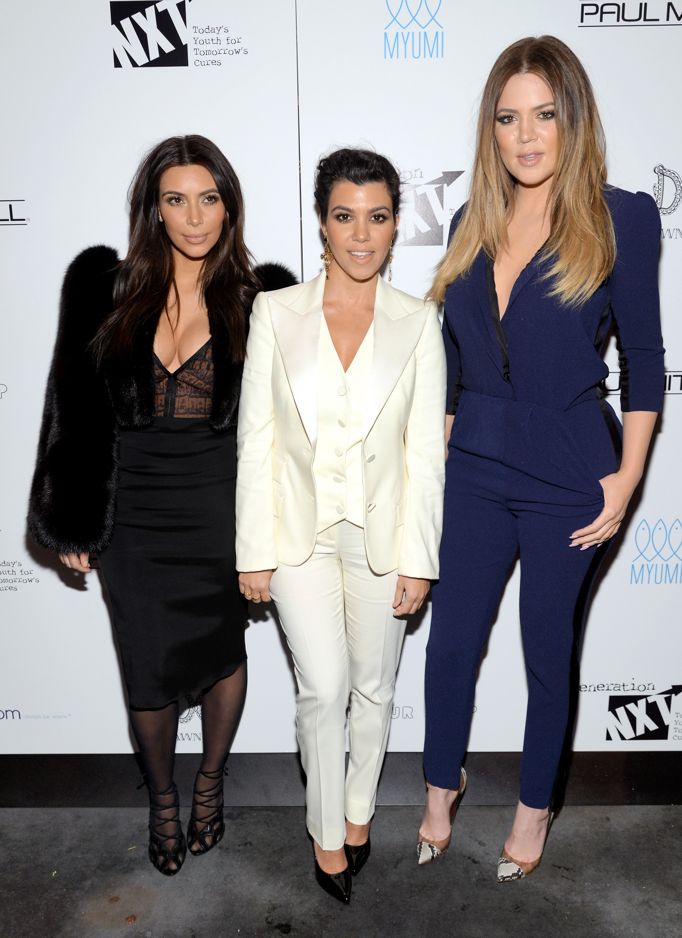 Television personalities Kim Kardashian, left, Kourtney Kardashian and Khloe Kardashian Odom, right, attend a Generation NXT Dream Foundation benefit event in New York on Feb. 16, 2014.