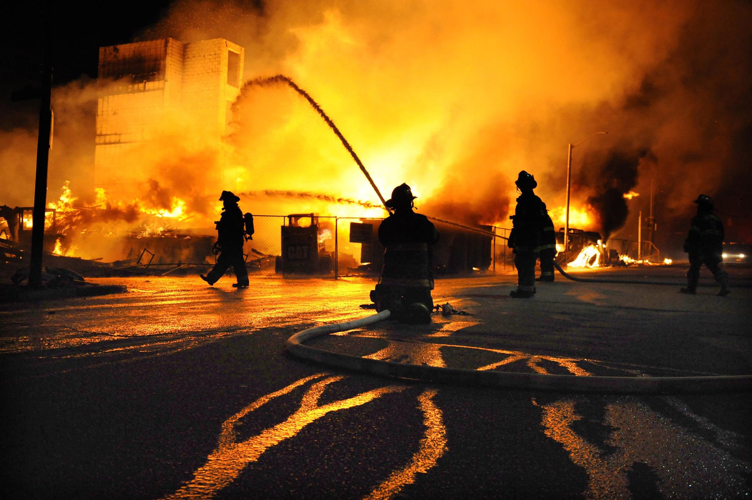 Firefighters battle a blaze after riots in Baltimore