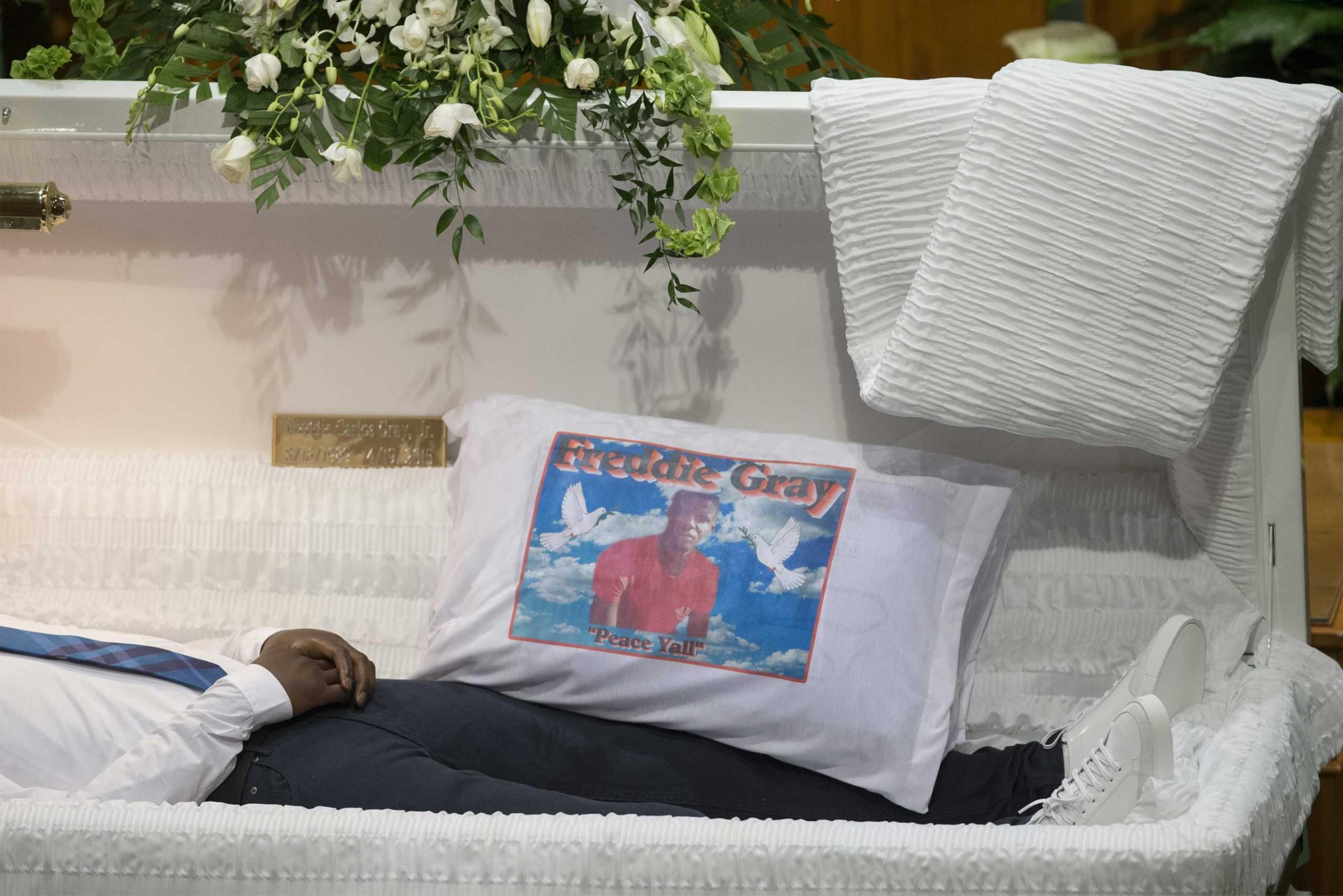 A pillow depicts the image of Freddie Gray inside his open casket during the funeral at New Shiloh Baptist Church in Baltimore on April 27, 2015.