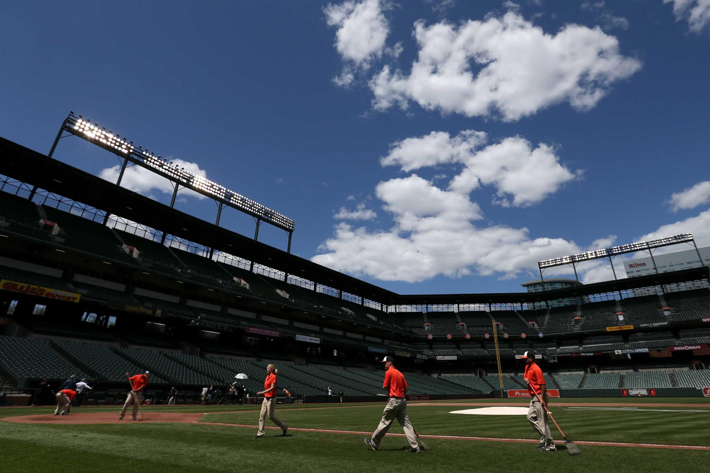The grounds crew prepares the field before the Baltimore Orioles play the Chicago White Sox at an empty Oriole Park at Camden Yards in Baltimore on April 29, 2015.