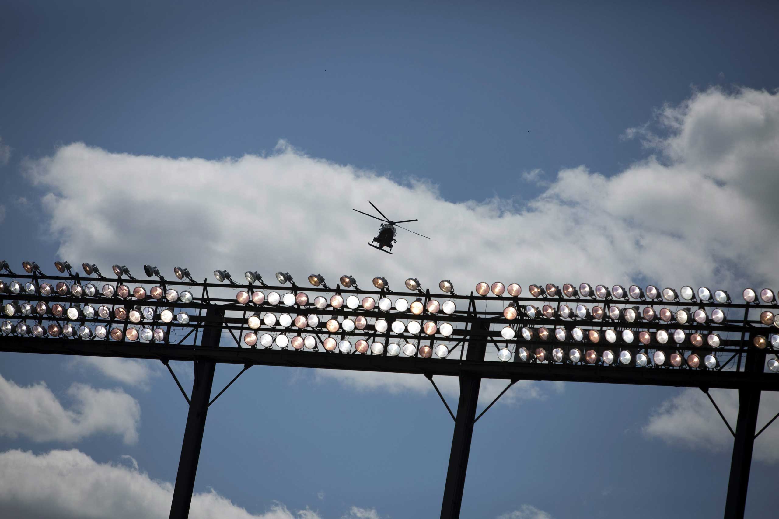 A Maryland State Trooper helicopter flies over Oriole Park at Camden Yards in Baltimore on April 29, 2015.