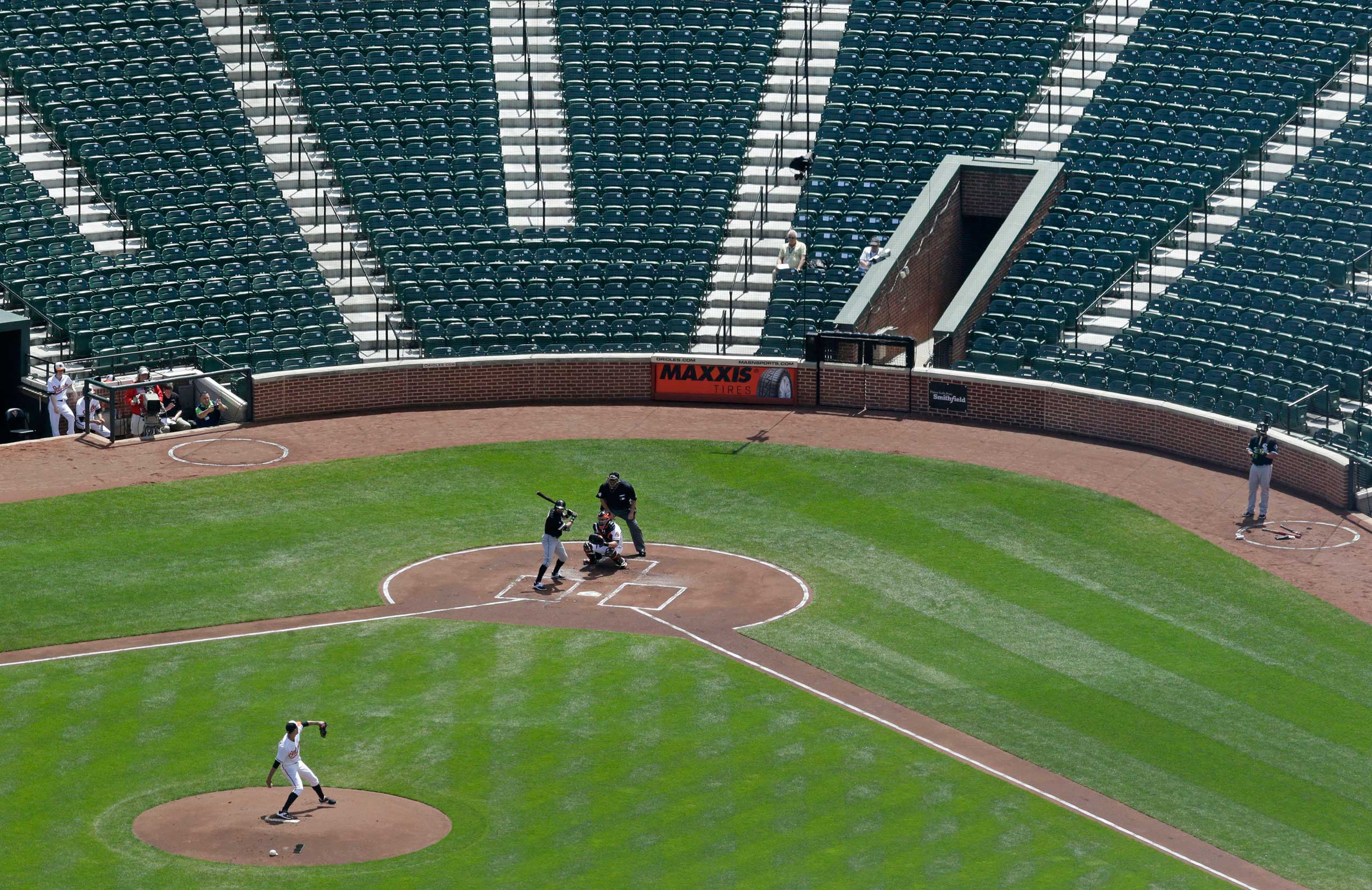 Baltimore Orioles starting pitcher Ubaldo Jimenez throws to Chicago White Sox's Adam Eaton in the first inning of a baseball game played in an empty Oriole Park at Camden Yards in Baltimore on April 29, 2015.