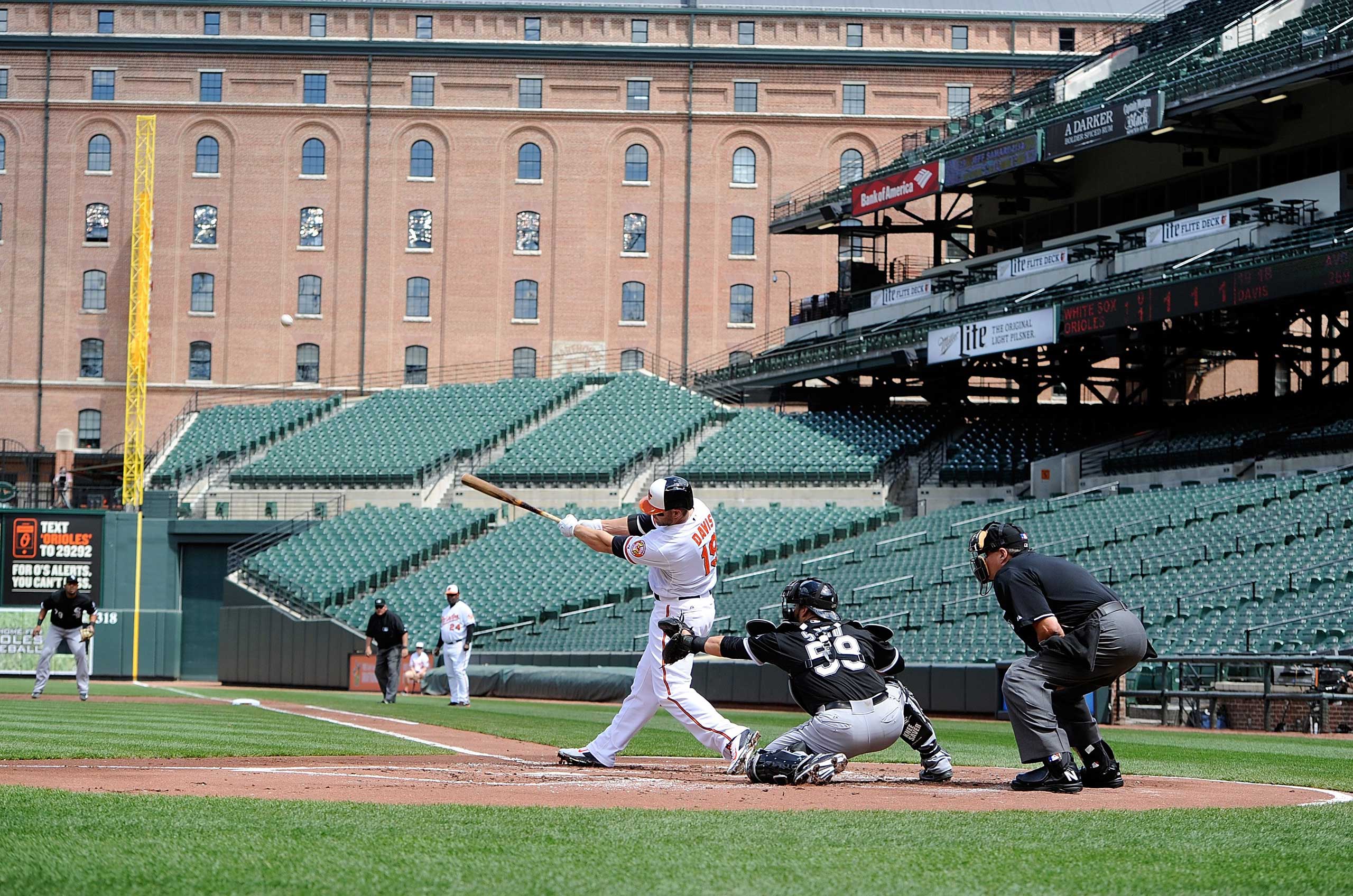 Chris Davis #19 of the Baltimore Orioles hits a three-run home run in the first inning against the Chicago White Sox at Oriole Park at Camden Yards in Baltimore on April 29, 2015.