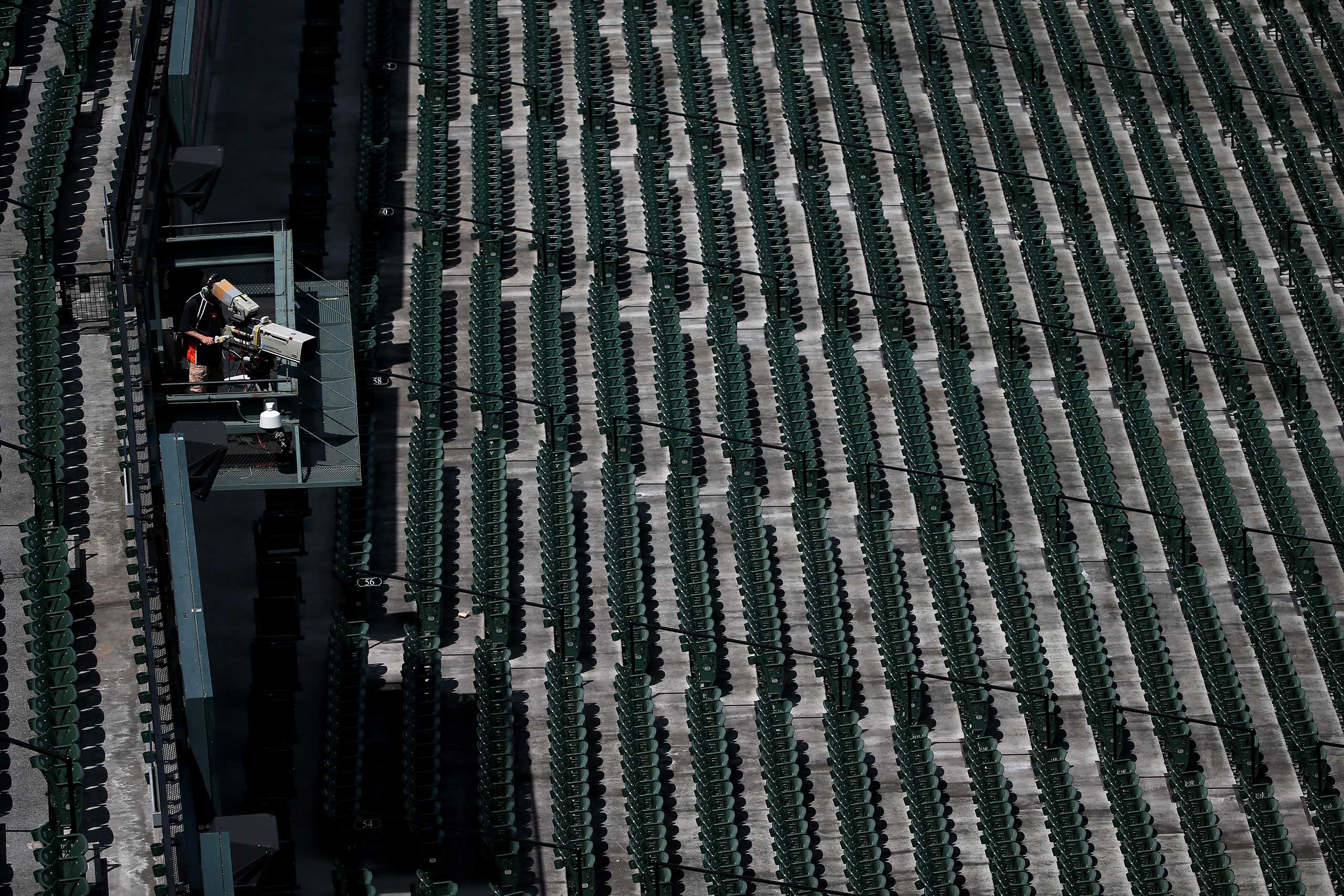 Empty seats are shown before the Baltimore Orioles play the Chicago White Sox at an empty Oriole Park at Camden Yards in Baltimore on April 29, 2015.