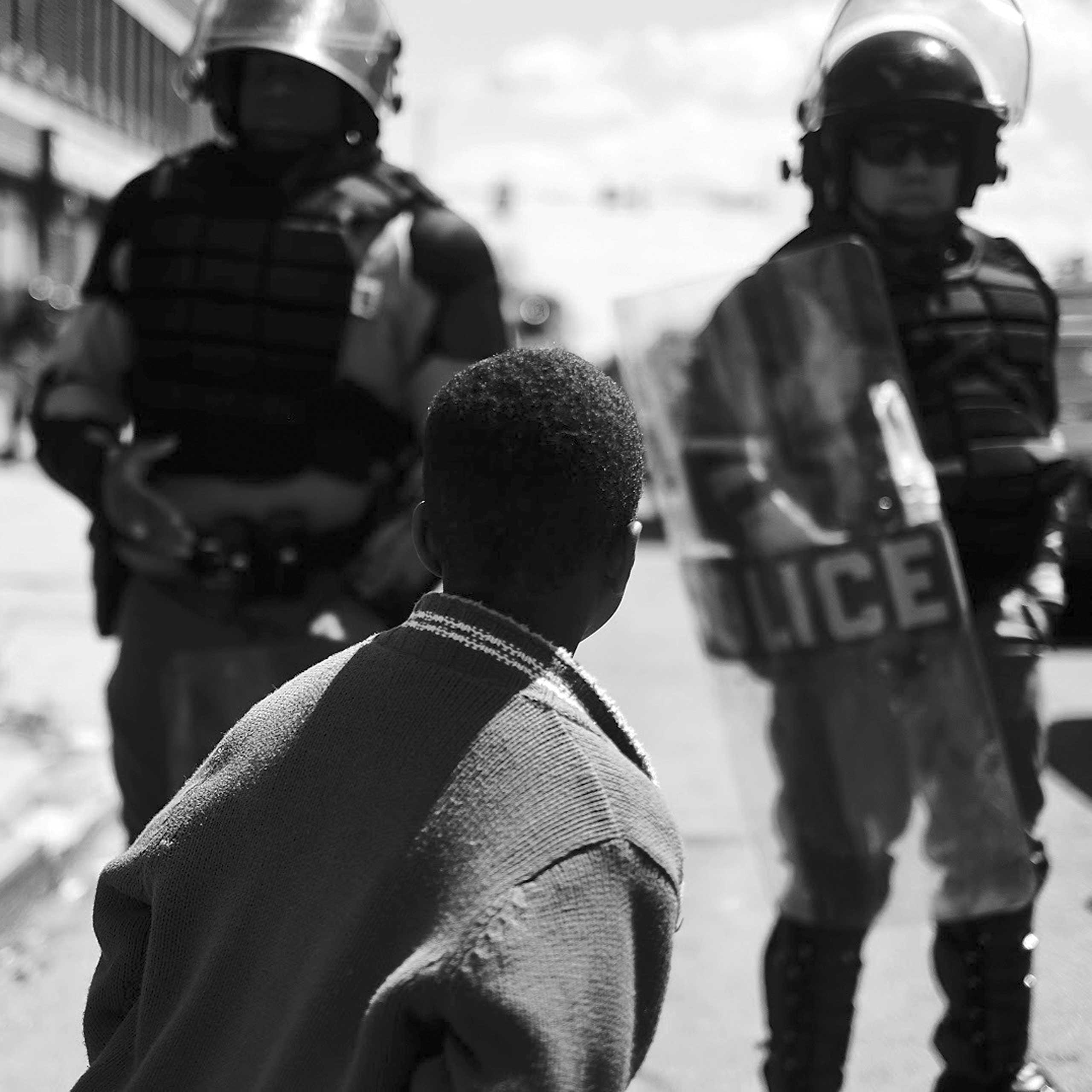 A young boy outside of a closed off street in  Baltimore on April 28, 2015