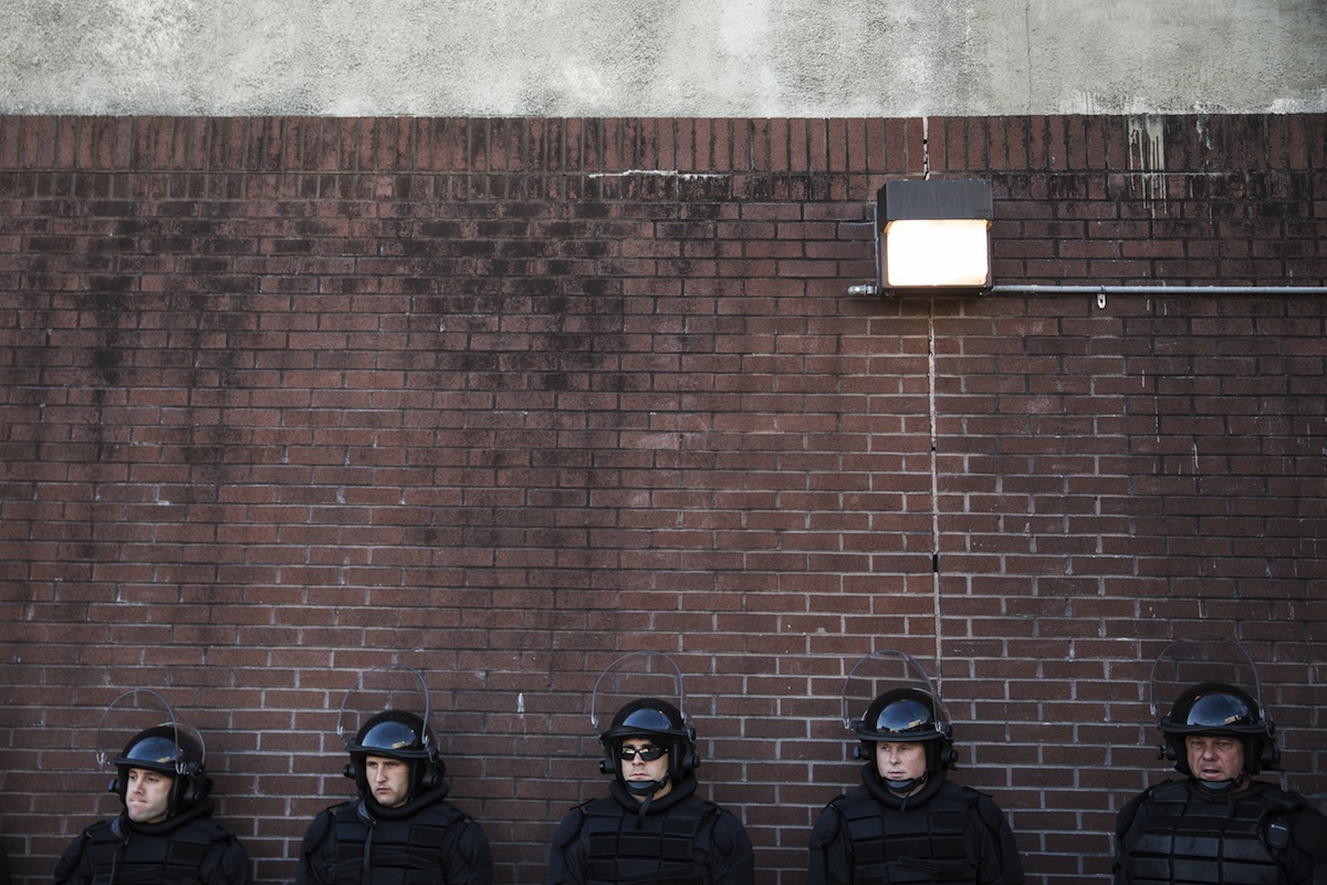 Police officers relax on April 29, 2015, in Baltimore (Andrew Burton—Getty Images)