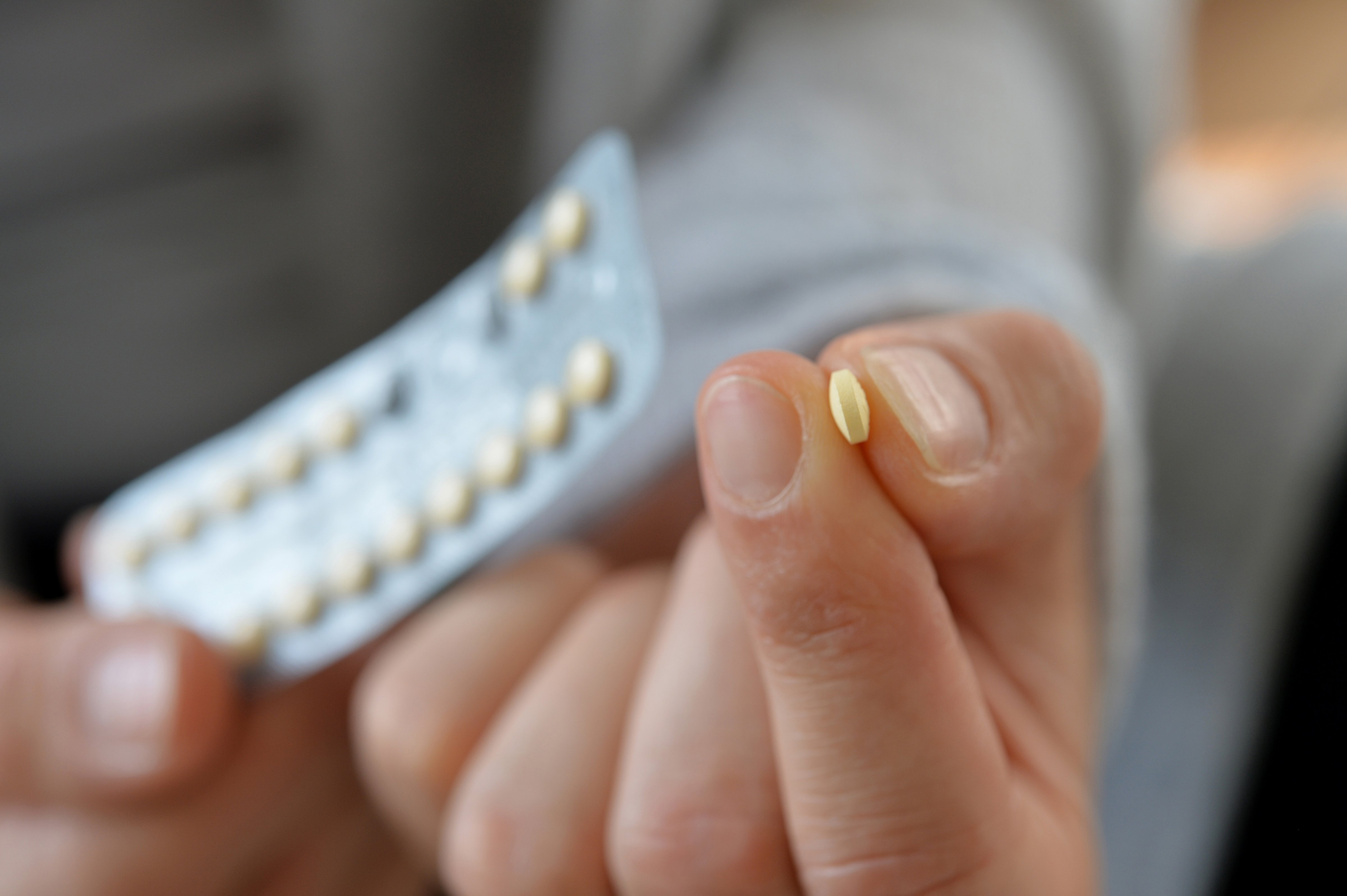 Woman taking birth controll pill