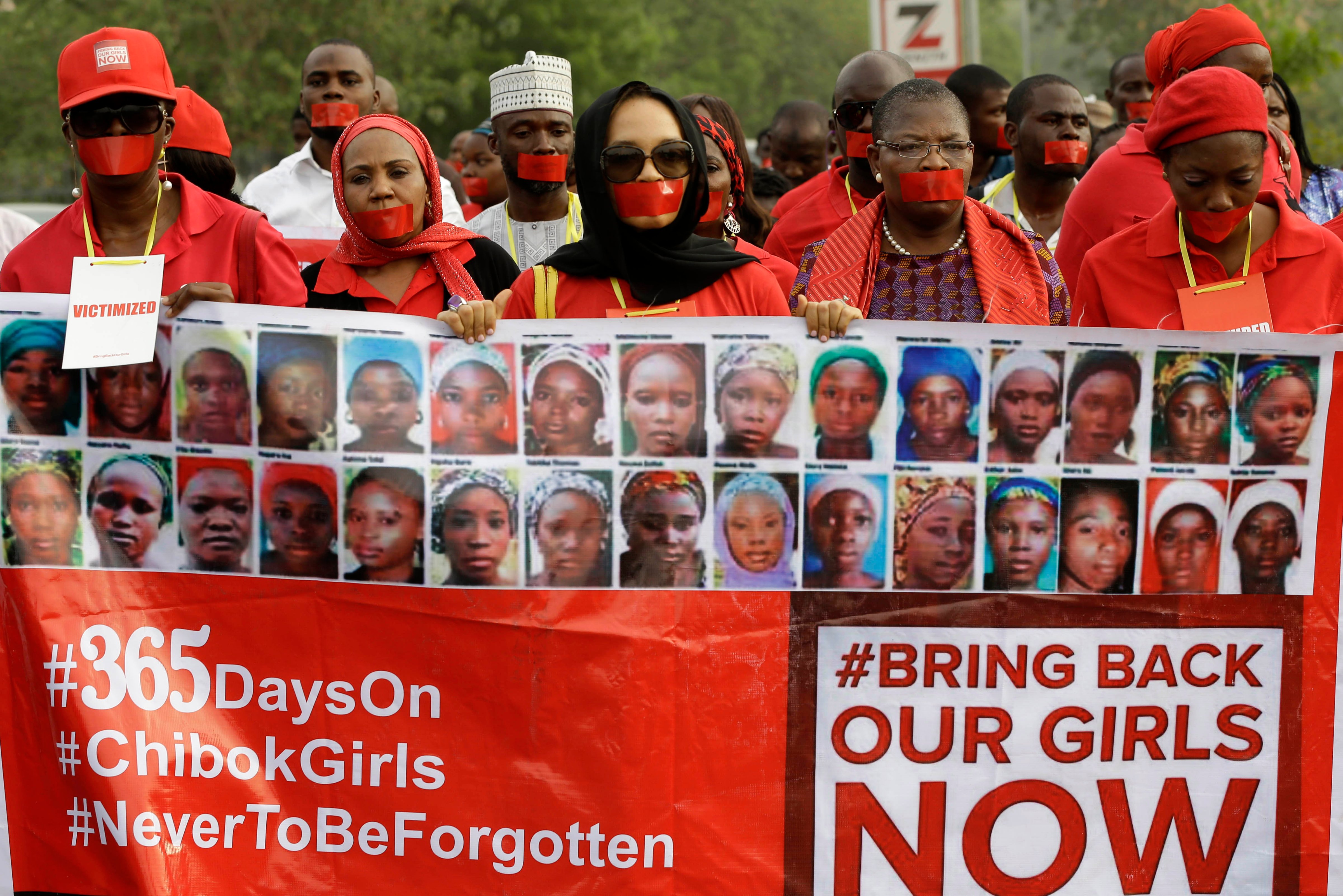 People march on a street of Abuja, Nigeria, during a silent protest on April 13, 2015, calling on the government to rescue the Chibok schoolgirls who were kidnapped a year ago (Sunday  Alamba—AP)