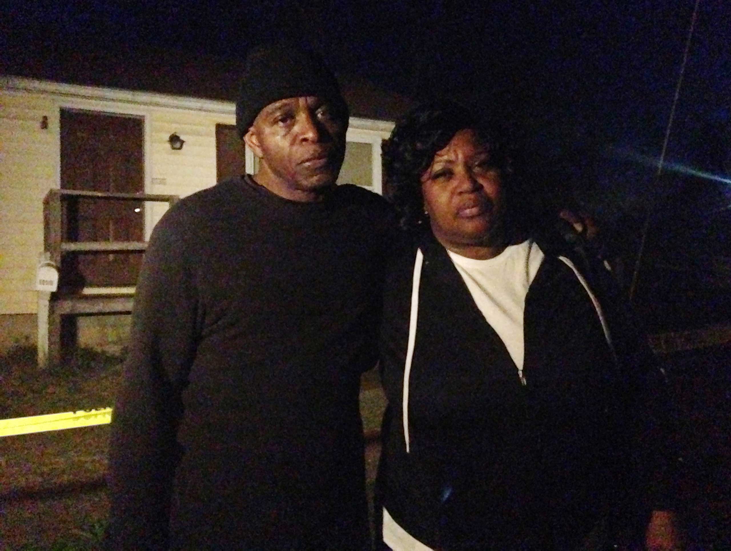 Lloyd Edwards, left, and Bonnie Edwards, the stepfather and mother of Rodney Todd stand outside the home where Todd and his seven children found dead Monday, April 6, 2015, in Princess Anne, Md. (Juliet Linderman—AP)