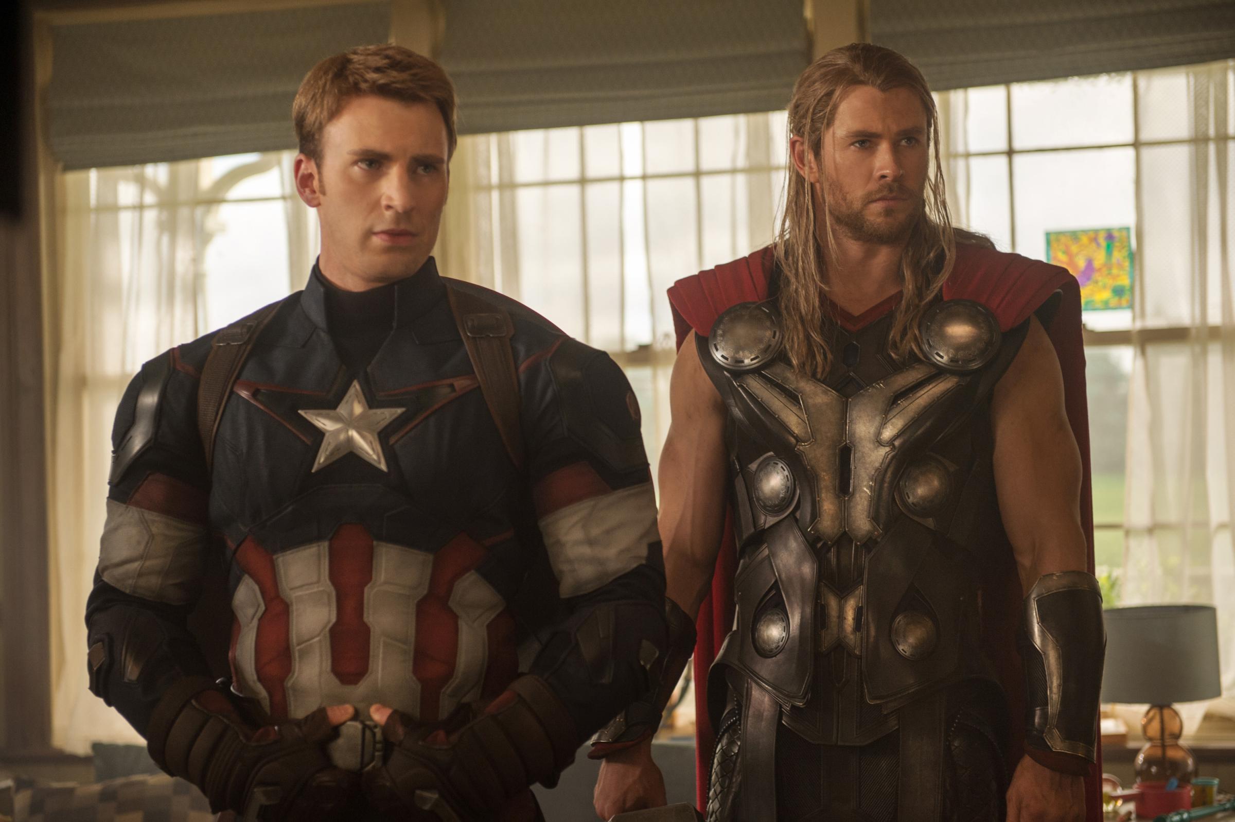 This photo provided by Disney/Marvel shows, Chris Evans, left, as Captain America/Steve Rogers, and Chris Hemsworth as Thor, in the new film, "Avengers: Age Of Ultron."