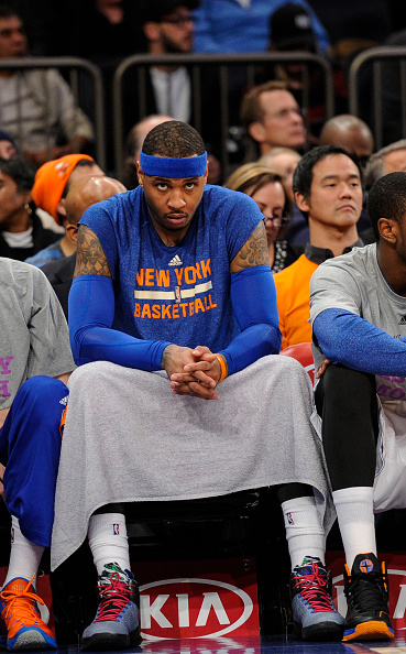 Carmelo Anthony sits on the bench at Madison Square Garden on Feb. 3, 2015.