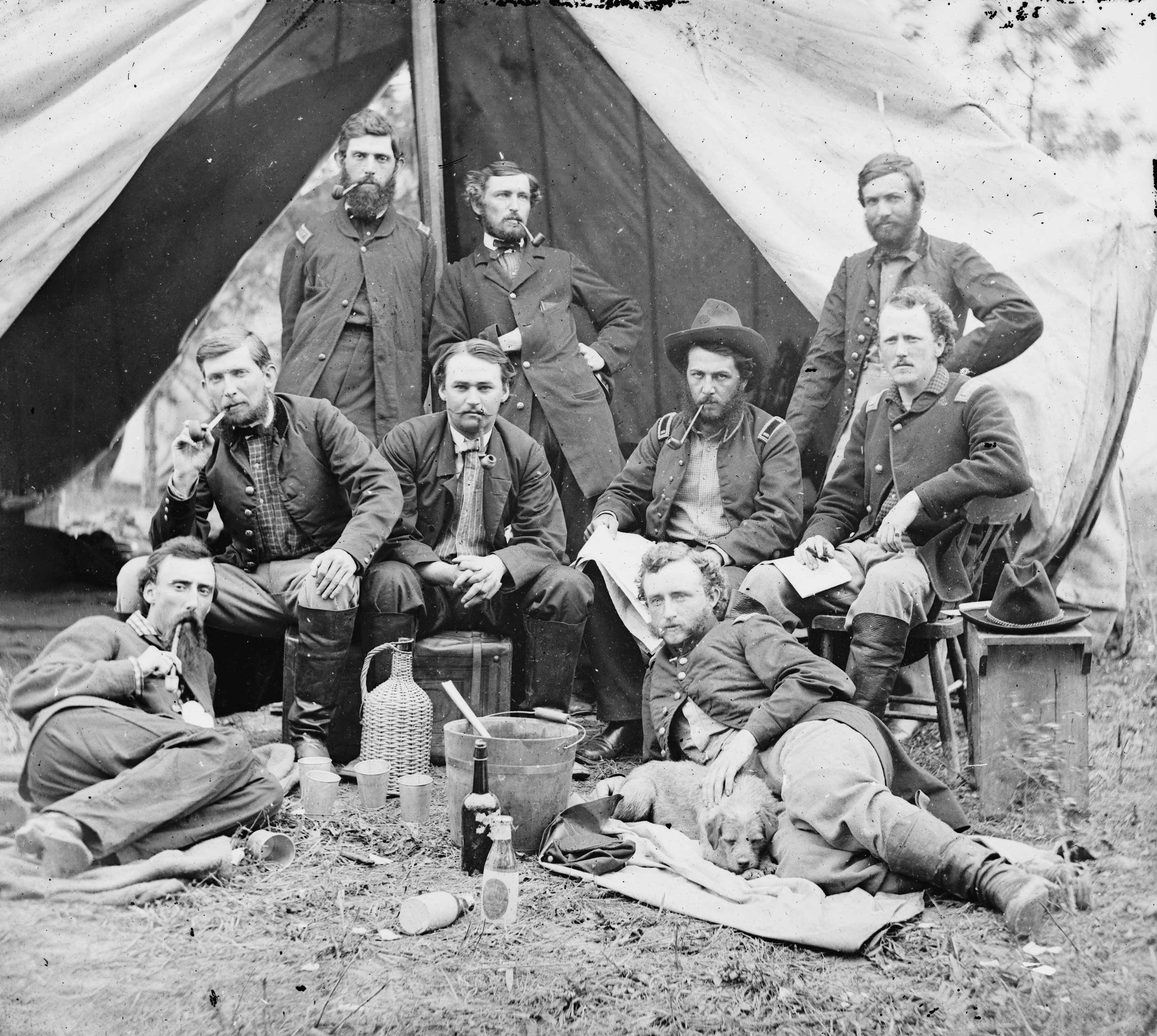 The staff of Gen. Fitz-John Porter, Lieutenant William G. Jones and George A. Custer reclining at Falmouth, Va., 1863