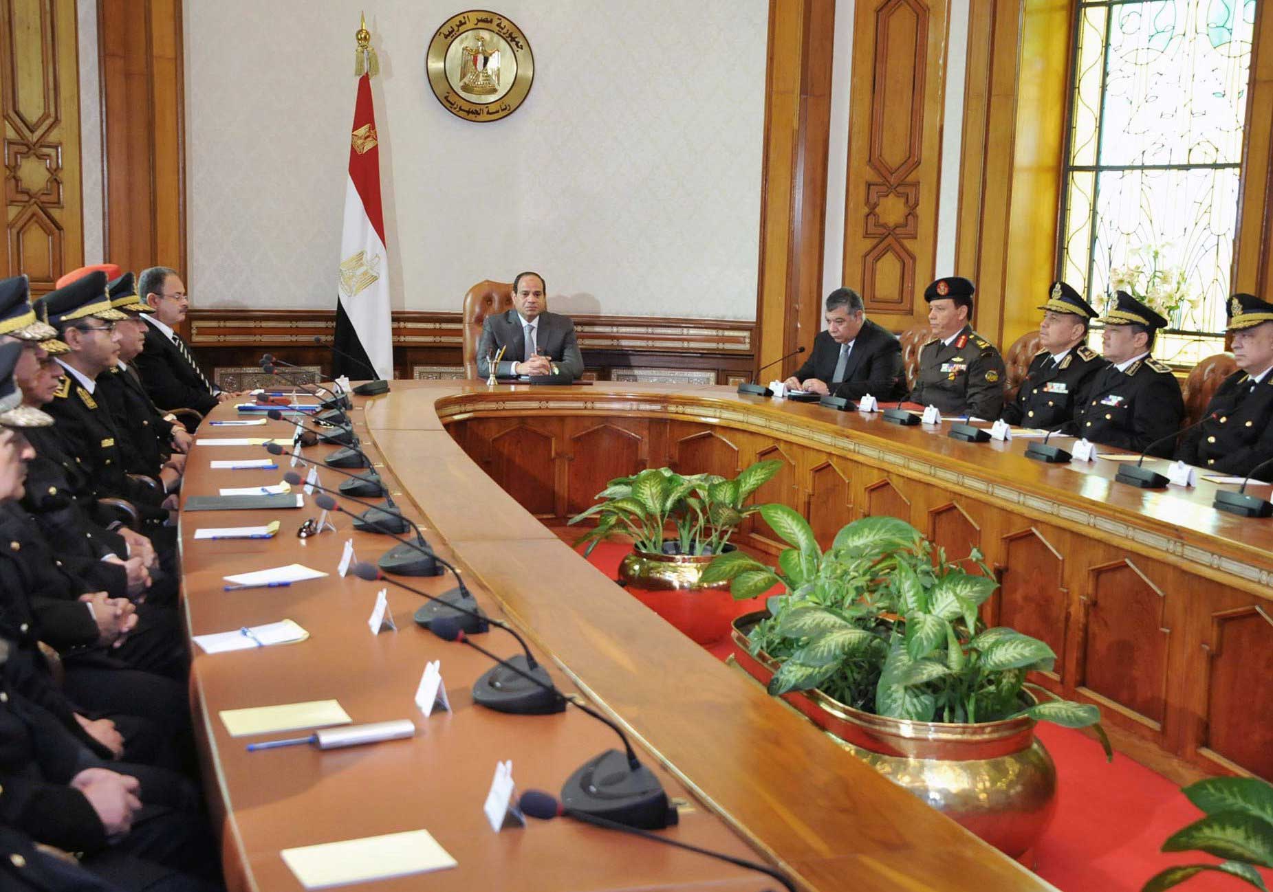 President Abdul Fattah al-Sisi meeting with his Interior Minister Magdy Abdel Ghaffar, left, the chief of intelligence and military officials in Cairo on April 16, 2015 (Fadi Fares—AFP/Getty Images)