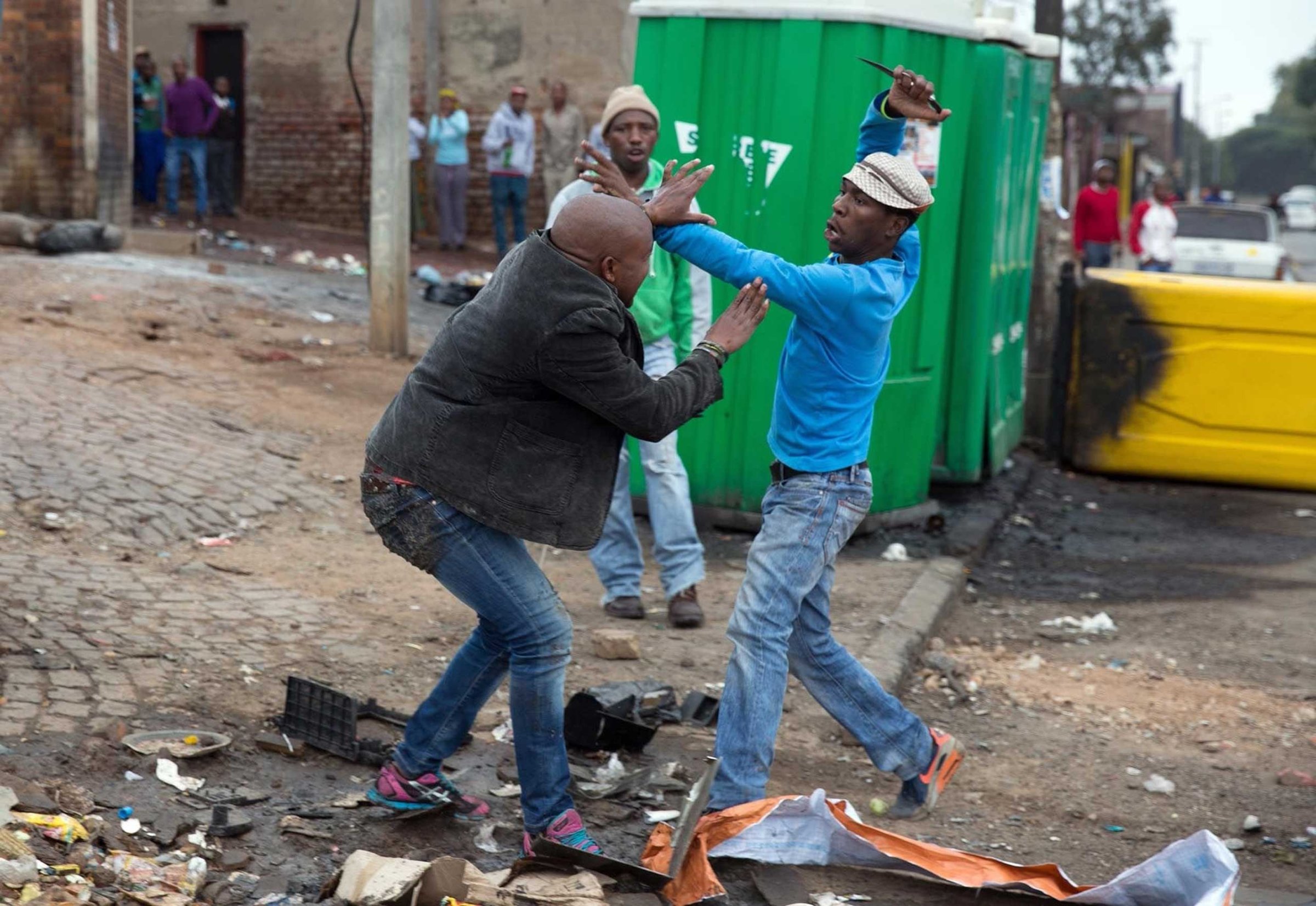 Mozambique national Emmanuel Sithole is attacked by men in Alexandra township during anti-immigrant violence in Johannesburg on April 18, 2015. He later died of his injuries.