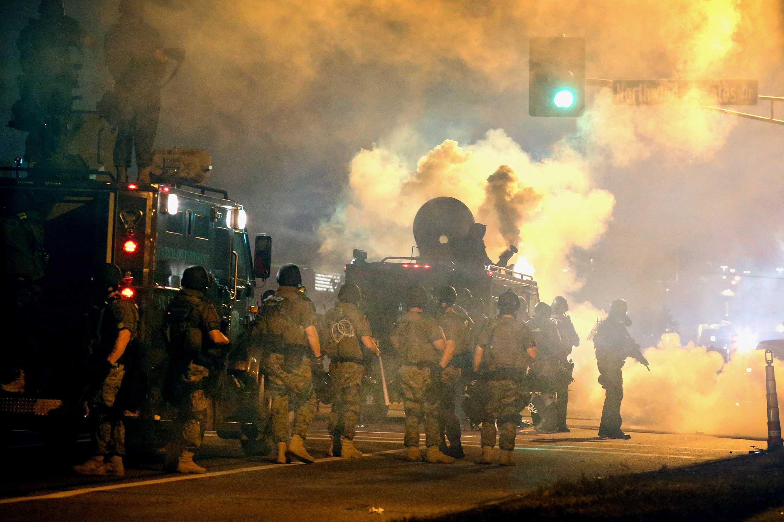 Police and Missouri National Guard attempt to control demonstrators protesting the killing of teenager Michael Brown on Aug. 18, 2014 in Ferguson, Mo. (Scott Olson—Getty Images)